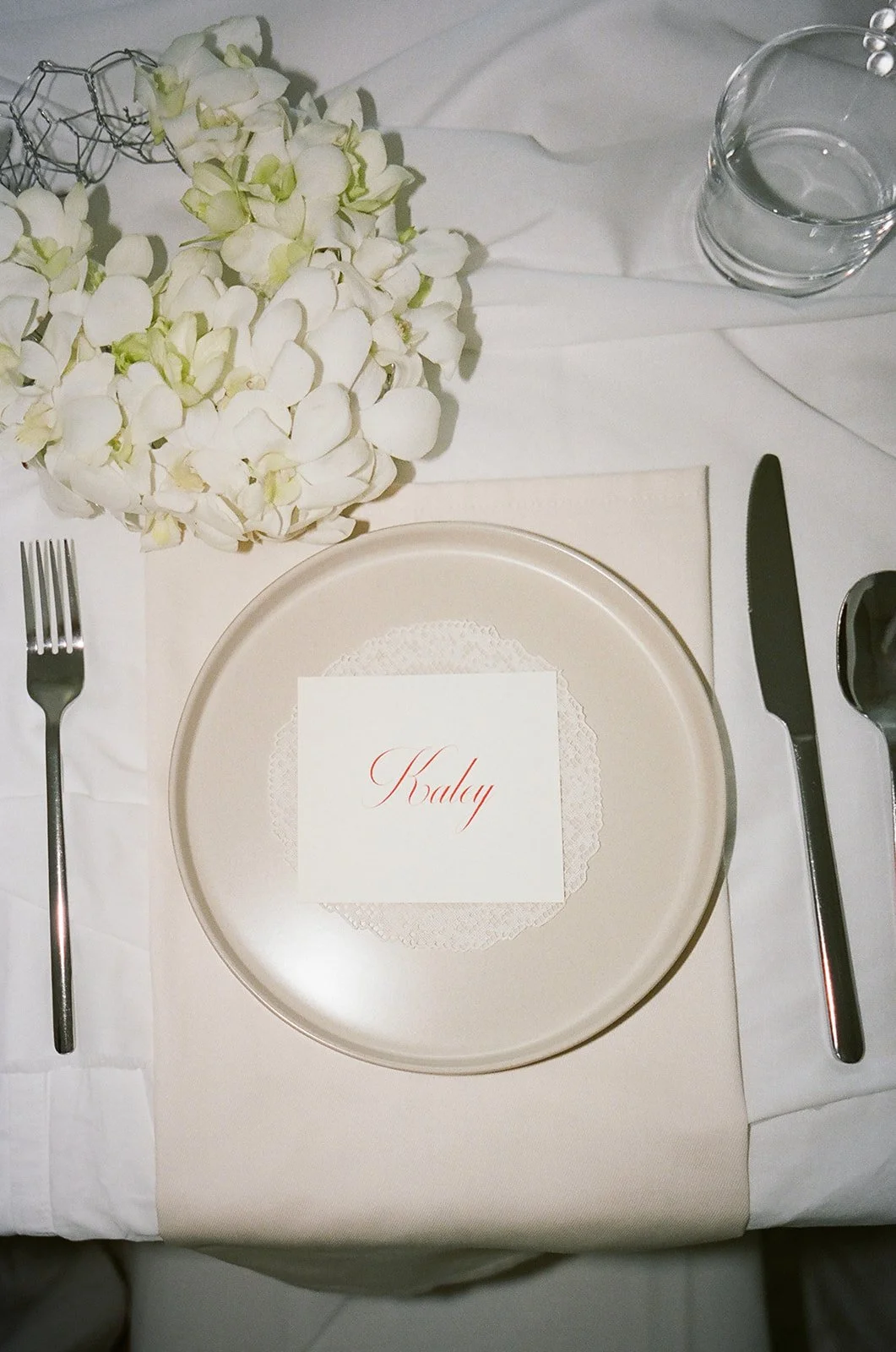 Chic Modern Baby Shower in a Cloud with layers of white draped fabric, simple calla lily centerpieces,  silver candlesticks, hanging floral installation the cottage rose kansas city florist crossroads flower purse orchid clutch flower purse place set