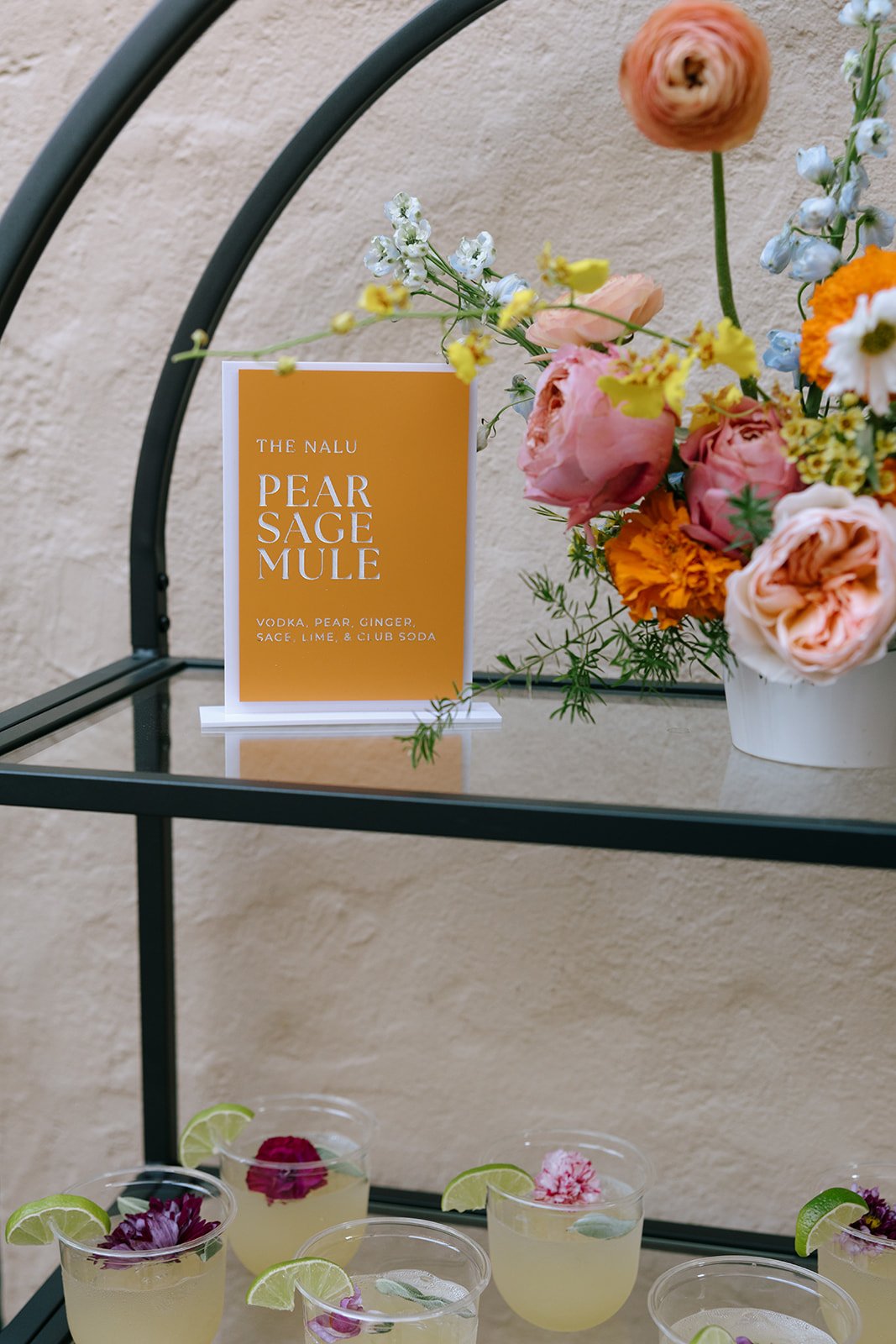 colorful flower filled october wedding in midtown kansas city la villa bridal bouquet wedding bouquet wedding flowers orchids garden roses ranunculus the cottage rose kansas city wedding florist crossroads cocktail flower arrangement