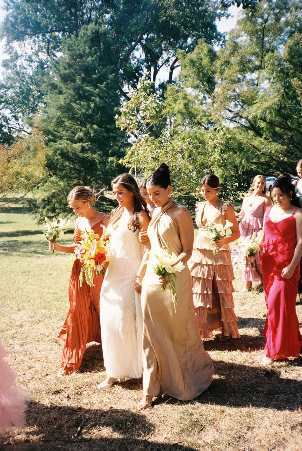Modern eclectic luxury wedding on the lawn at liberty memorial greenhouse tent wedding outdoor reception fall wedding october the cottage rose kansas city wedding florist crossroads bridesmaids colorful dressed white and green bouquets callas