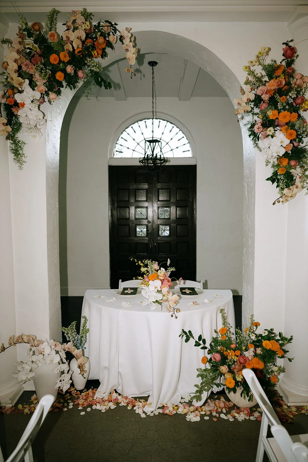 colorful flower filled october wedding in midtown kansas city la villa bridal bouquet wedding bouquet wedding flowers orchids garden roses sweetheart table the cottage rose kansas city wedding florist crossroads ceremony hanging flower arrangement