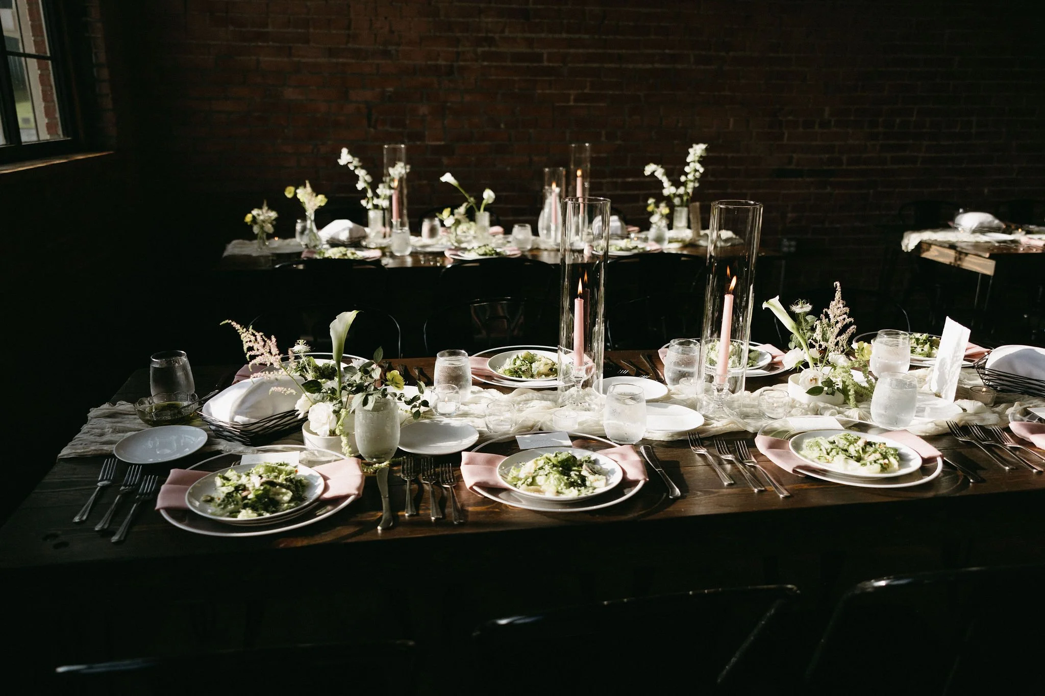 modern spring garden wedding warm color palette yellow peach lilac the cottage rose kansas city florist crossroads powell garden reception hanging greenery bud vases taper candles ikebana flower arrangements centerpieces calla lilies