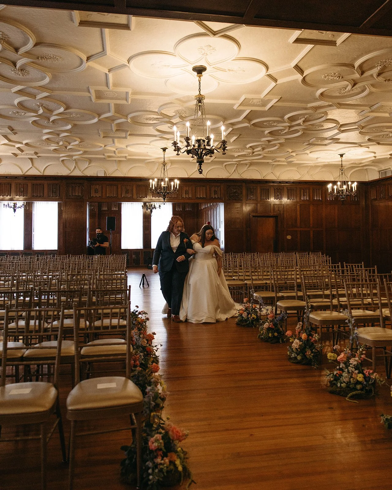 candlelit whimiscal spring garden wedding pastel color palette same sex wedding ceremony fireplace floral installation aisle flowers downtown kc hotel kansas city the cottage rose kansas city wedding florist crossroads