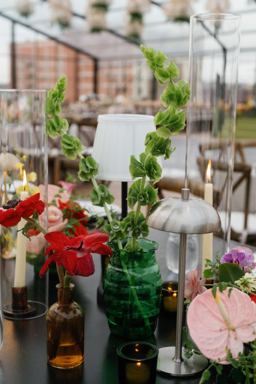 Modern eclectic luxury wedding on the lawn at liberty memorial greenhouse tent wedding outdoor reception fall wedding decor october wedding the cottage rose kansas city wedding florist crossroads centerpieces lamps candles ikebana bud vases