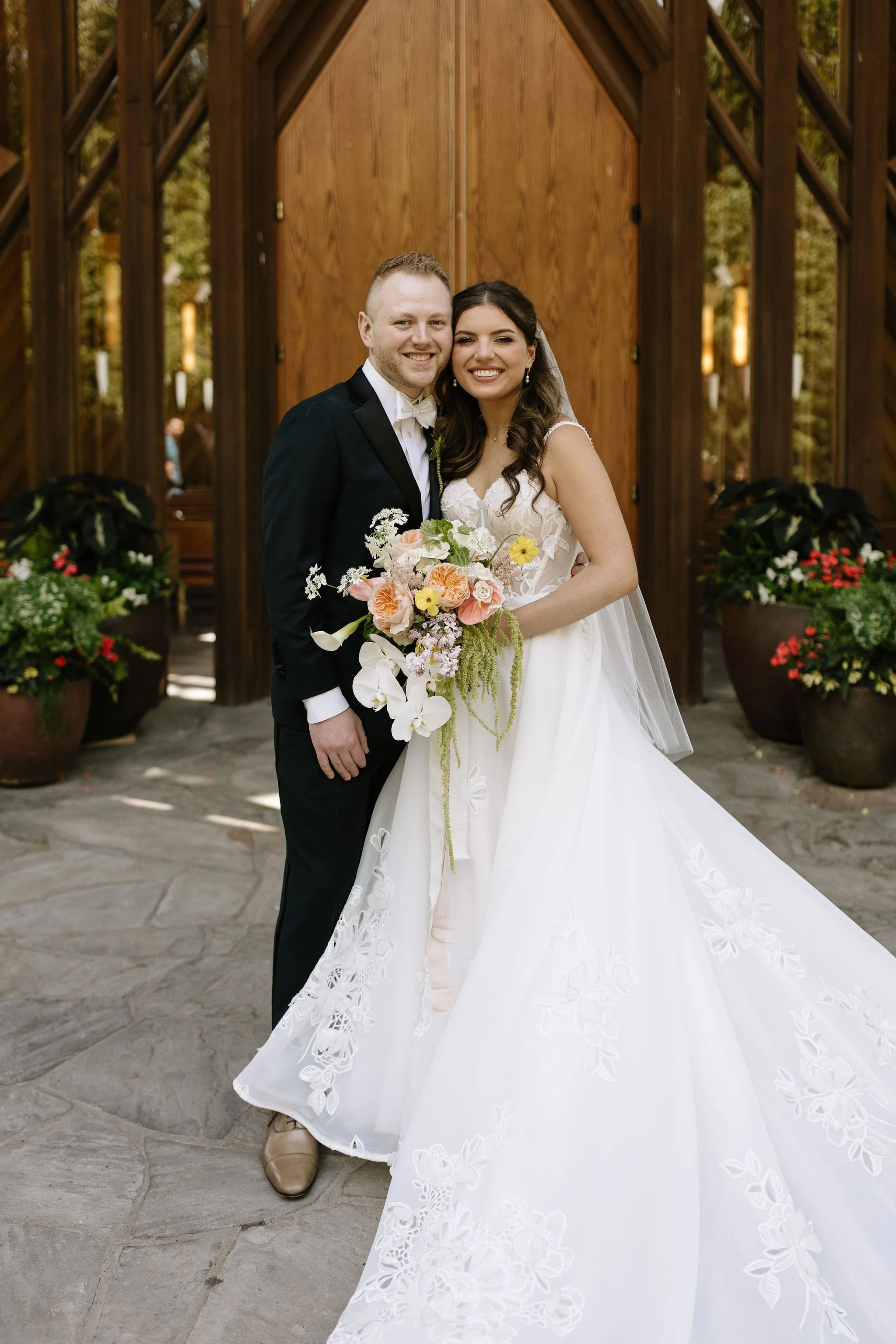 modern spring garden wedding large statement bridal bouquet bride and groom portraits bridal style the cottage rose kansas city florist crossroads powell garden ceremony chapel