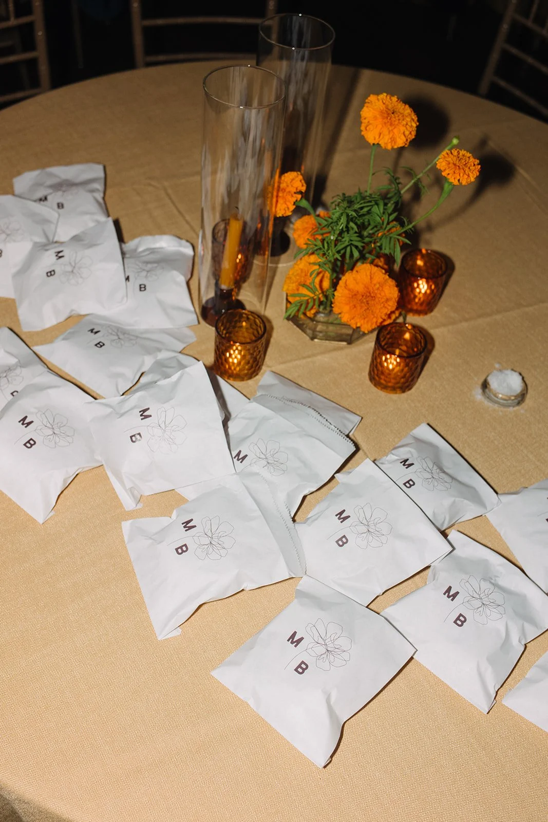 Modern september wedding reception orange and yellow color palette craspedia bud vases centerpieces silver candelabra  the cottage rose kansas city wedding florist crossroads hotel kansas city wedding orange marigold ikebana arrangement centerpiece