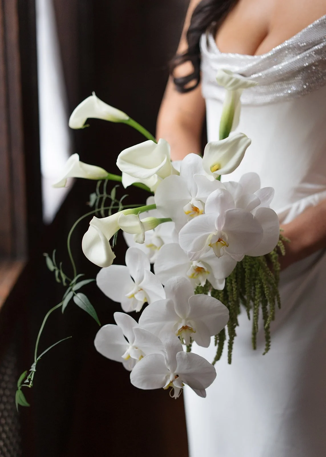 Modern chic november fall wedding downtown hotel kansas city orchids calla lilies amaranth bouquet anthurium bridal portrait chic bridal style the cottage rose kansas city wedding florist crossroads