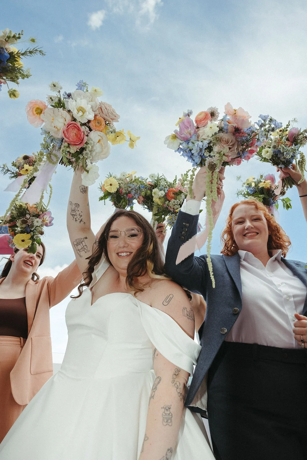 whimiscal spring garden wedding pastel color palette same sex wedding personal flowers bridal bouquets  downtown kc hotel kansas city the cottage rose kansas city wedding florist crossroads bridal portraits