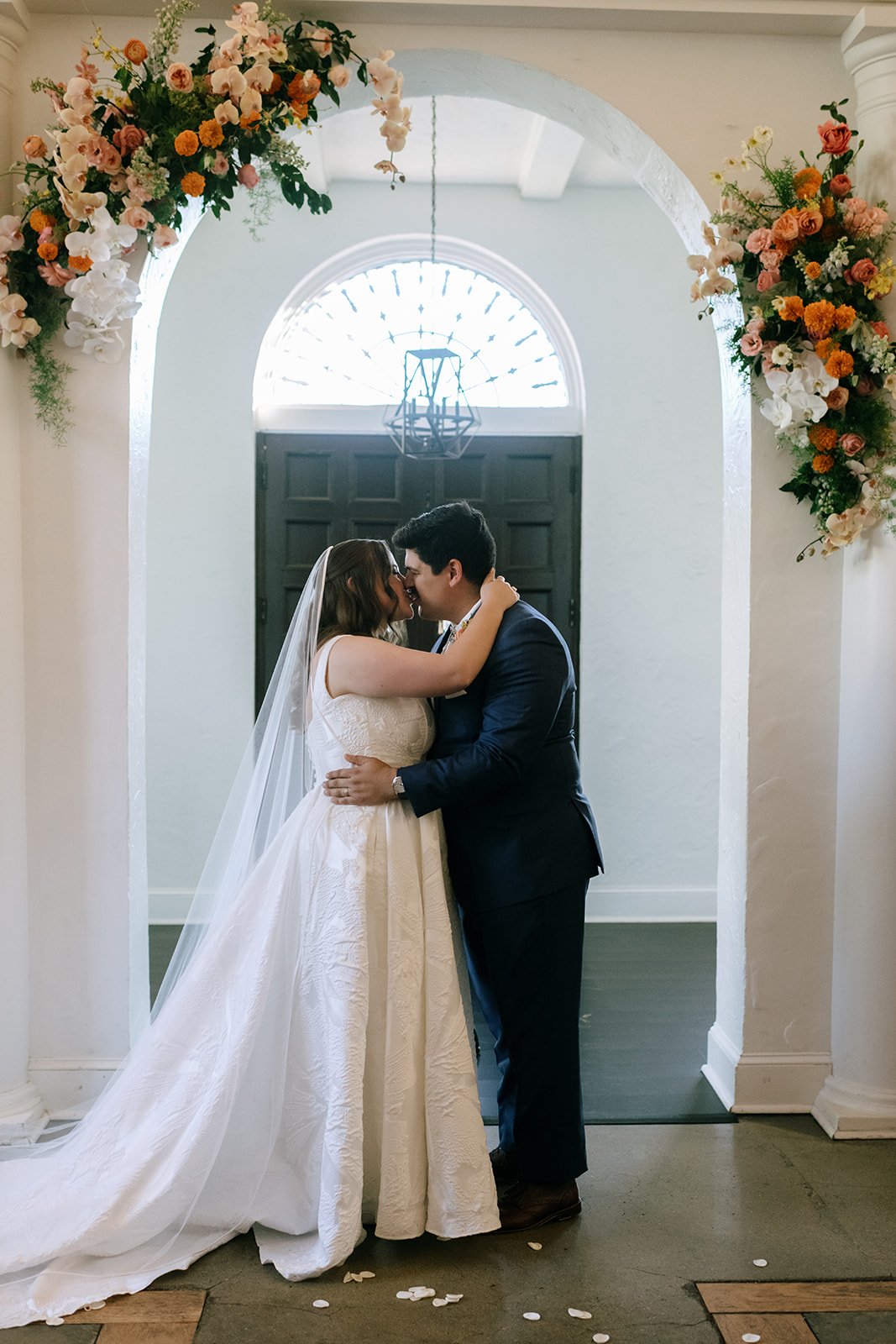 colorful flower filled october wedding in midtown kansas city la villa bridal bouquet wedding bouquet wedding flowers orchids garden roses ranunculus the cottage rose kansas city wedding florist crossroads ceremony hanging flower arrangement