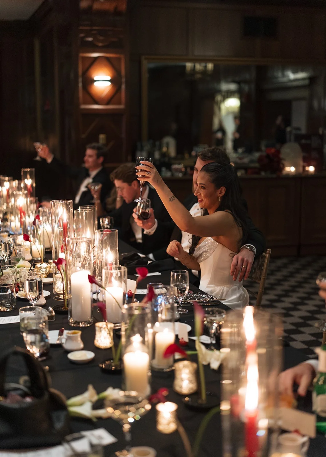 Modern chic november fall wedding downtown hotel kansas city rose petals orchids wedding reception centerpiece head table candles calla lily ikebana arrangement the cottage rose kansas city wedding florist crossroads bride and groom toast