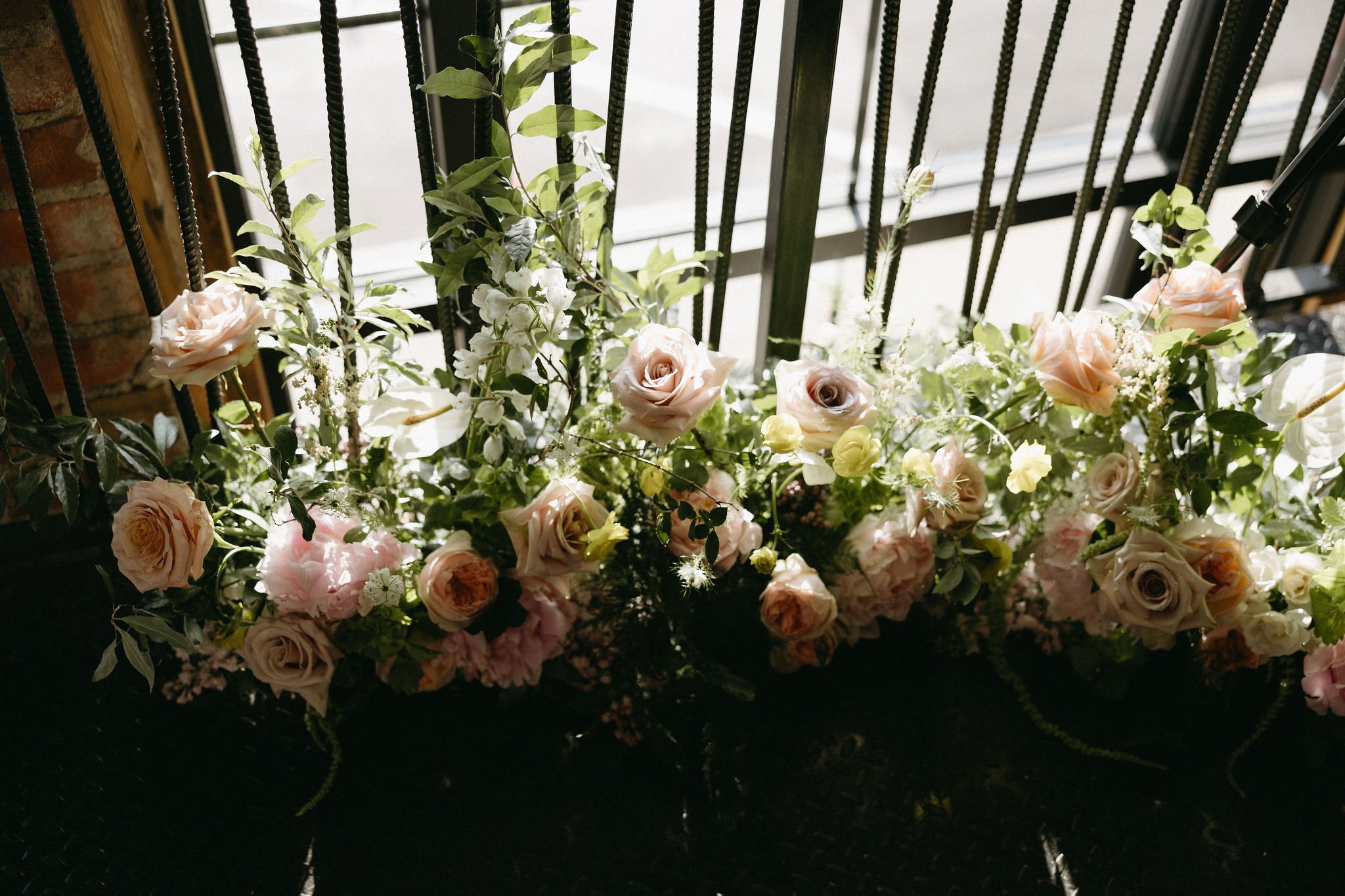 modern spring garden wedding warm color palette yellow peach green the cottage rose kansas city florist crossroads powell garden reception floral ground installation roses peonies