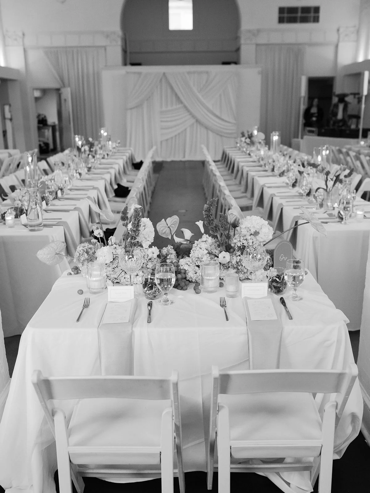 Sculptural modern spring wedding bud vases fruit and flowers candles hanging installation midtown la villa spring flowers the cottage rose kansas city wedding florist crossroads sweetheart table decor reception