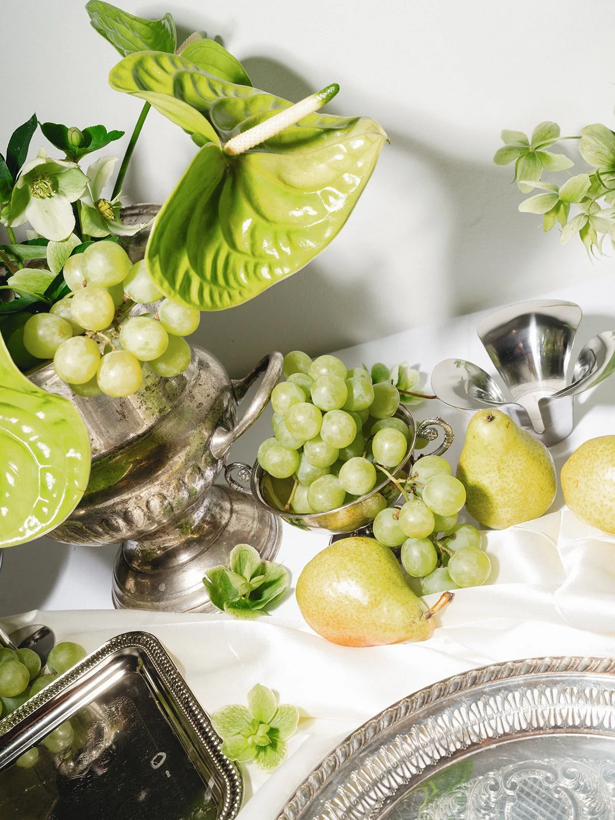 Sculptural modern spring wedding bud vases fruit and flowers candles hanging installation midtown la villa spring flowers the cottage rose kansas city wedding florist crossroads reception decor antique silver chrome