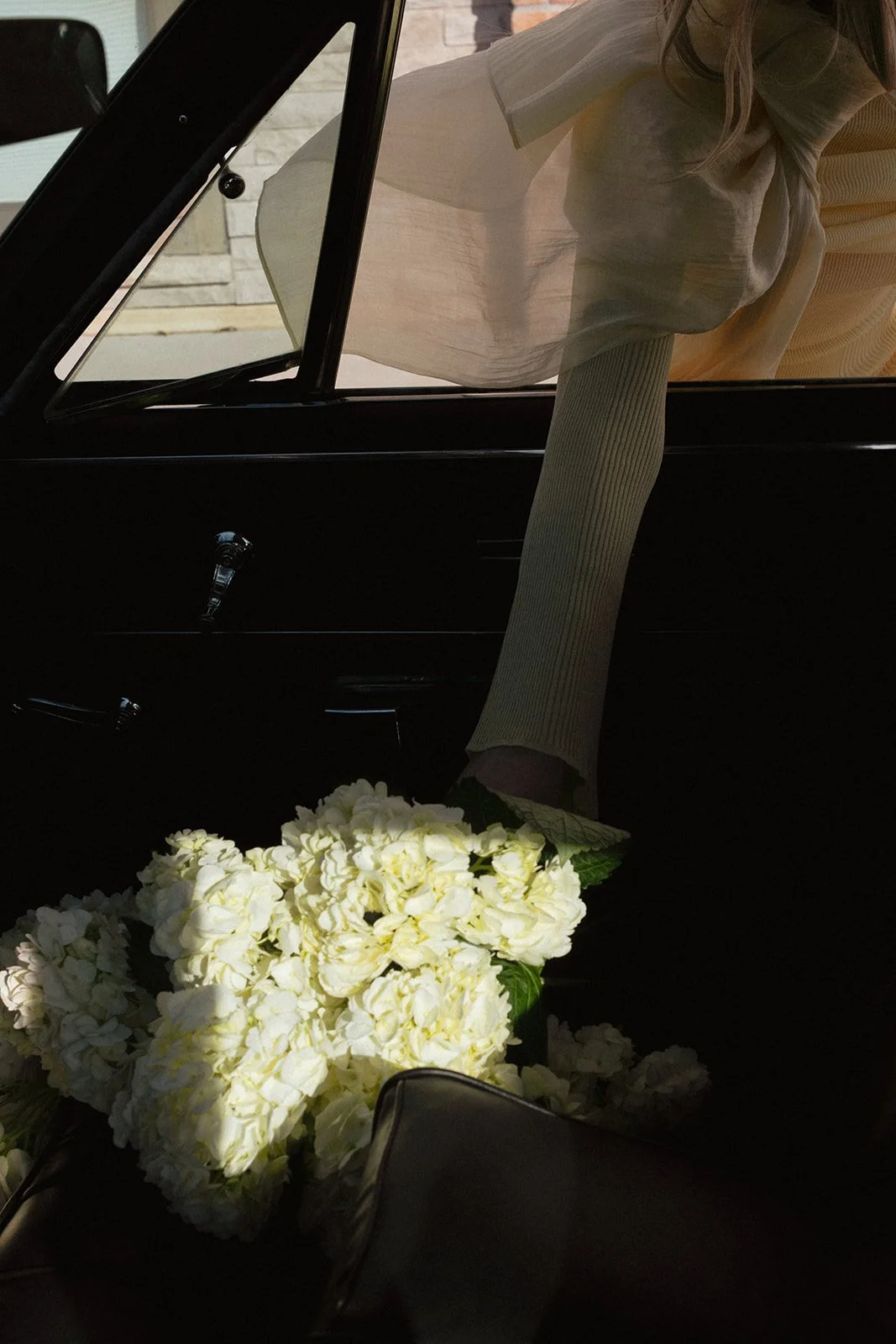 vintage car holding hydrangea the cottage rose kansas city wedding florist crossroads branding shoot interior designer