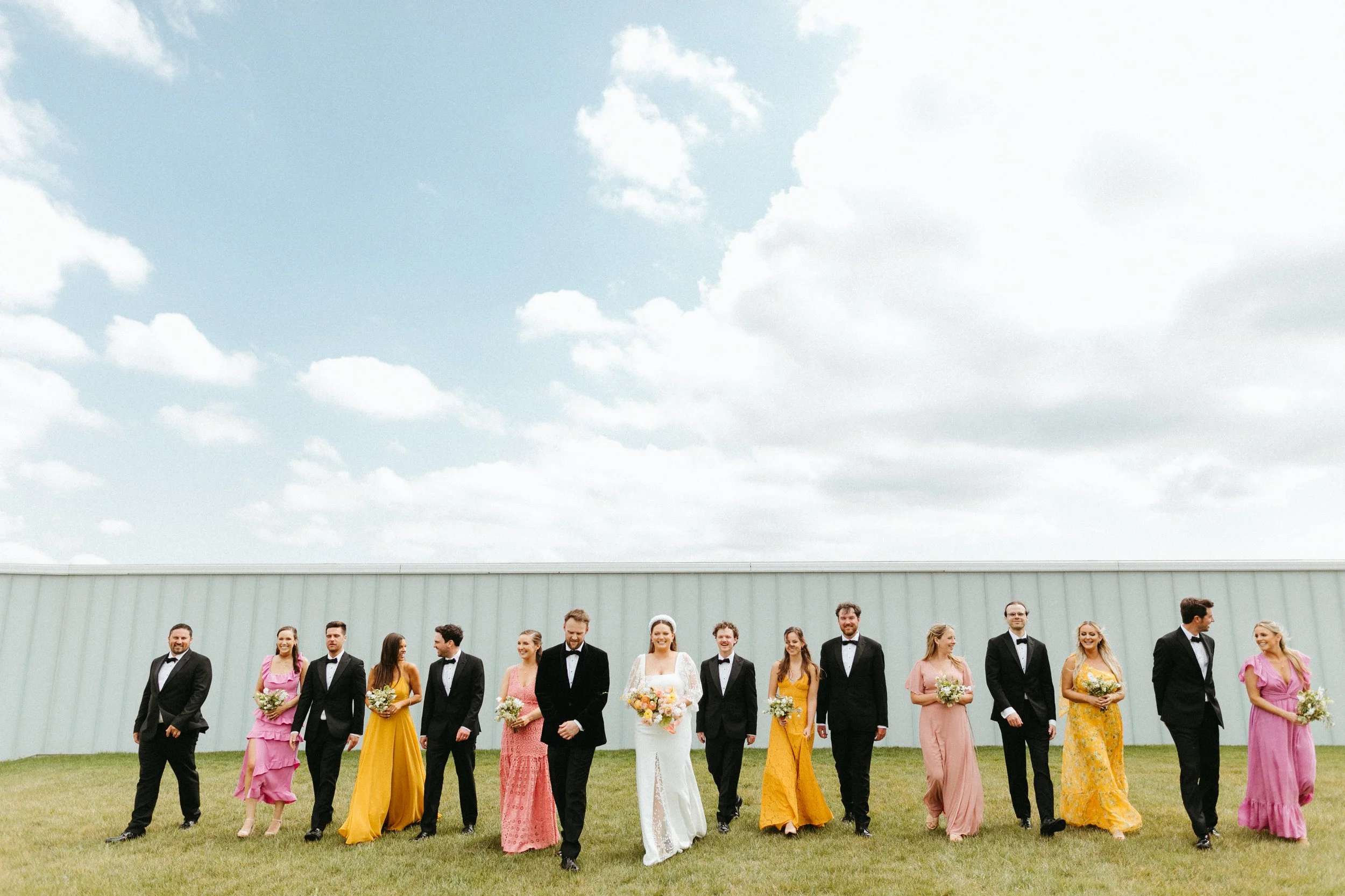 Bride and bridesmaids with bouquets nelson atkins backdrop large lush spring bridal bouquet modern bridal style the grand hall downtown kc the cottage rose kansas city wedding florist crossroads