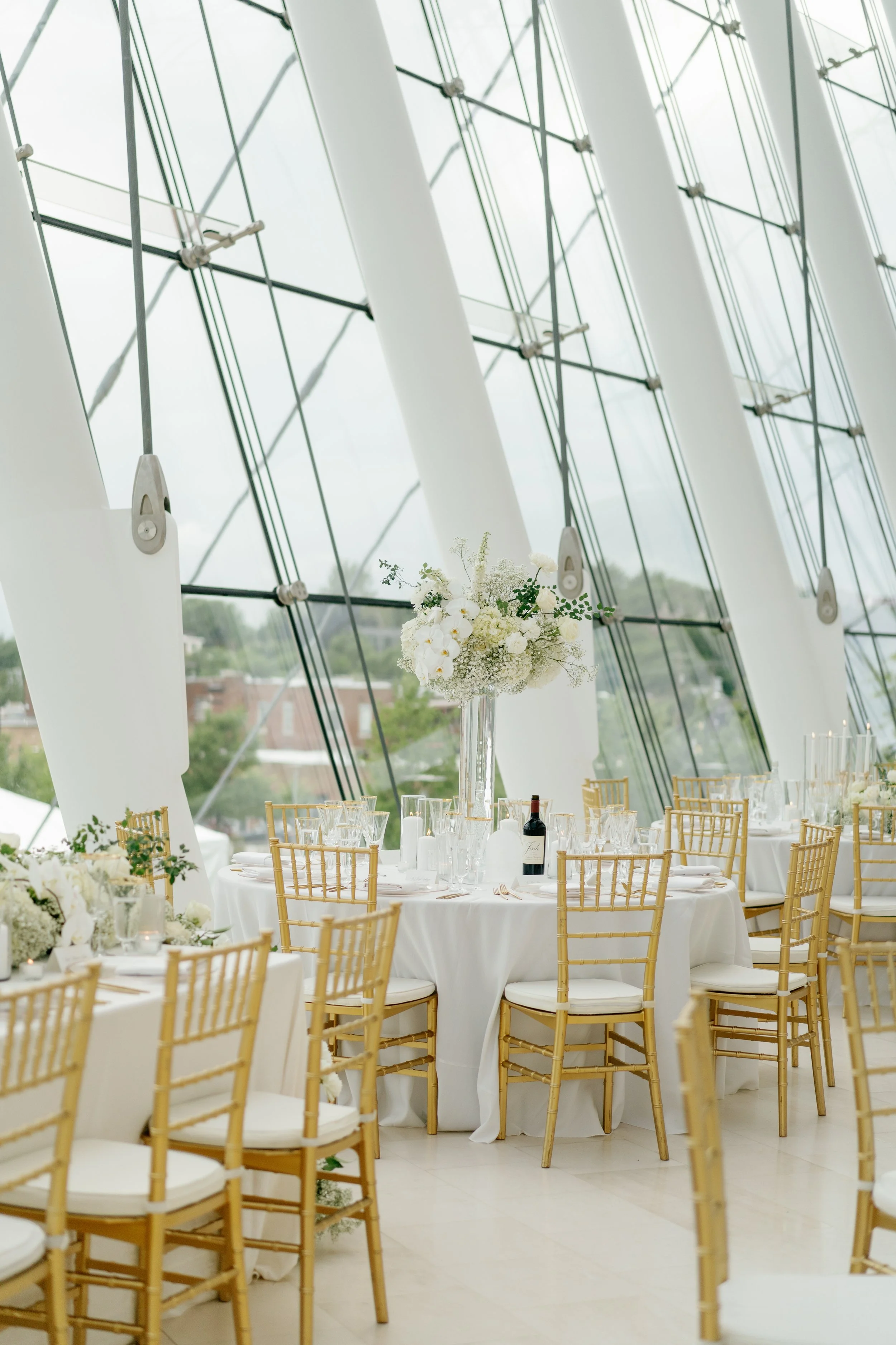 Modern chic spring wedding kauffman center for the performing arts cloud dancer inspiration head table garland tall centerpieces low floral arrangement babys breath orchids calla lilies the cottage rose kansas city wedding florist crossroads