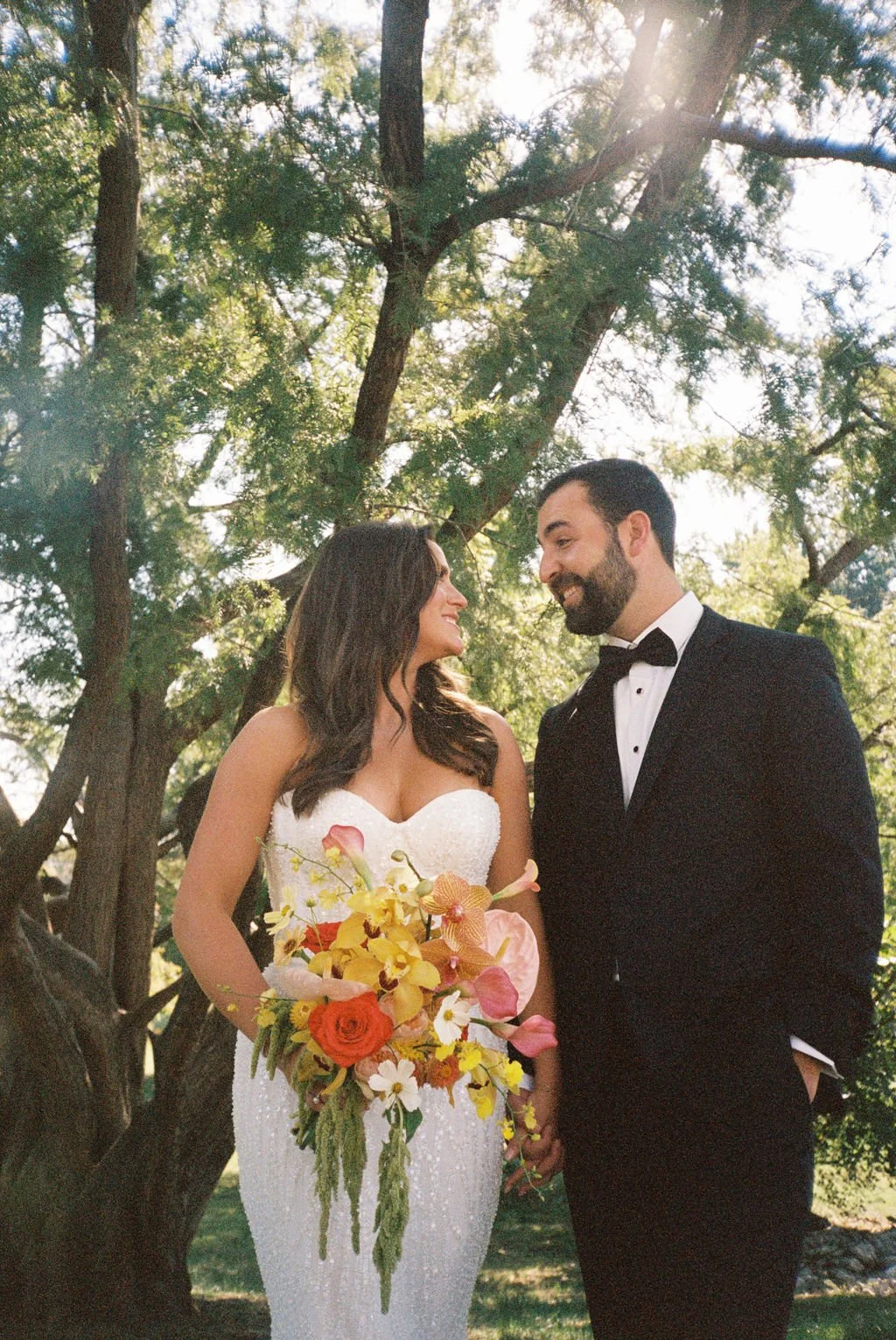 Modern eclectic luxury wedding on the lawn at liberty memorial greenhouse tent wedding outdoor reception fall wedding decor october the cottage rose kansas city wedding florist crossroads bride groom colorful orchid bridal bouquet anthurim callas