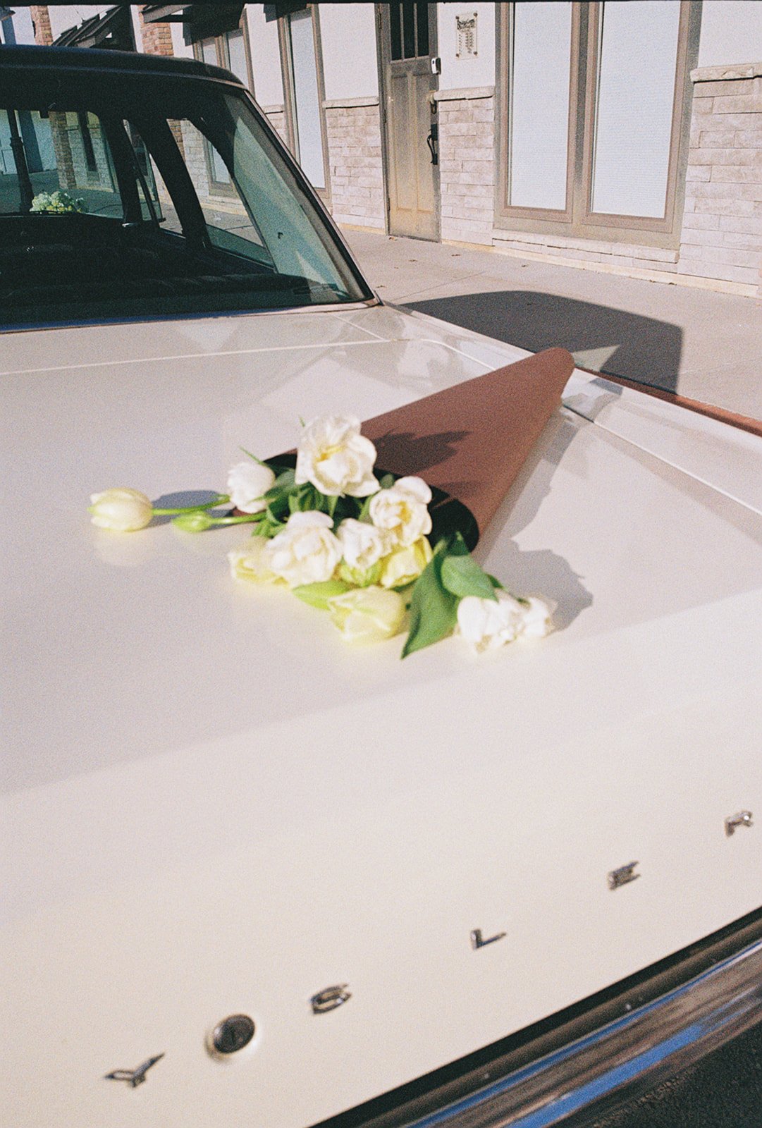 vintage car tulip bouquet wrapped the cottage rose kansas city wedding florist crossroads branding shoot interior designer