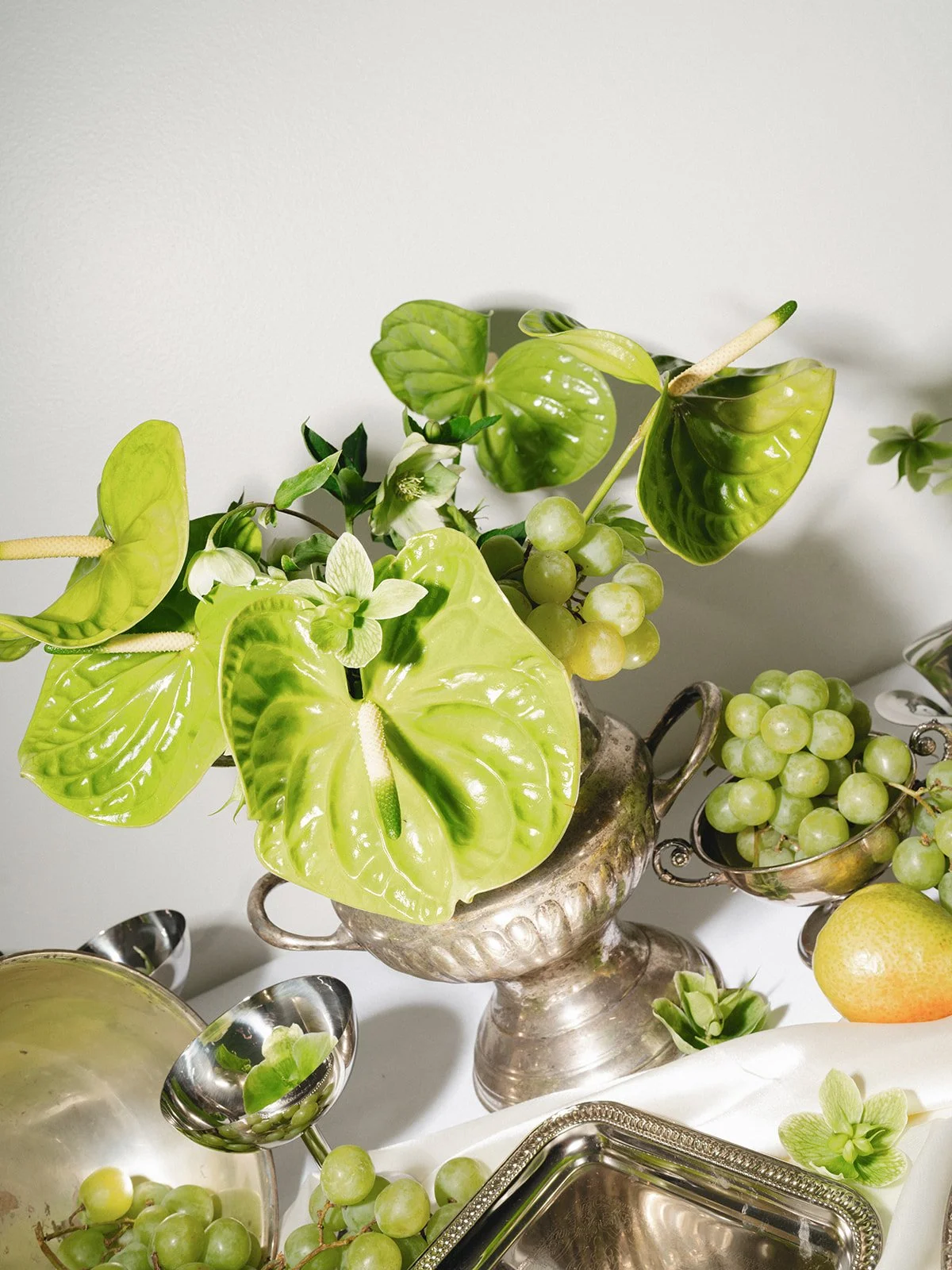 Sculptural modern spring wedding bud vases fruit and flowers candles hanging installation midtown la villa spring flowers the cottage rose kansas city wedding florist crossroads reception decor antique silver chrome