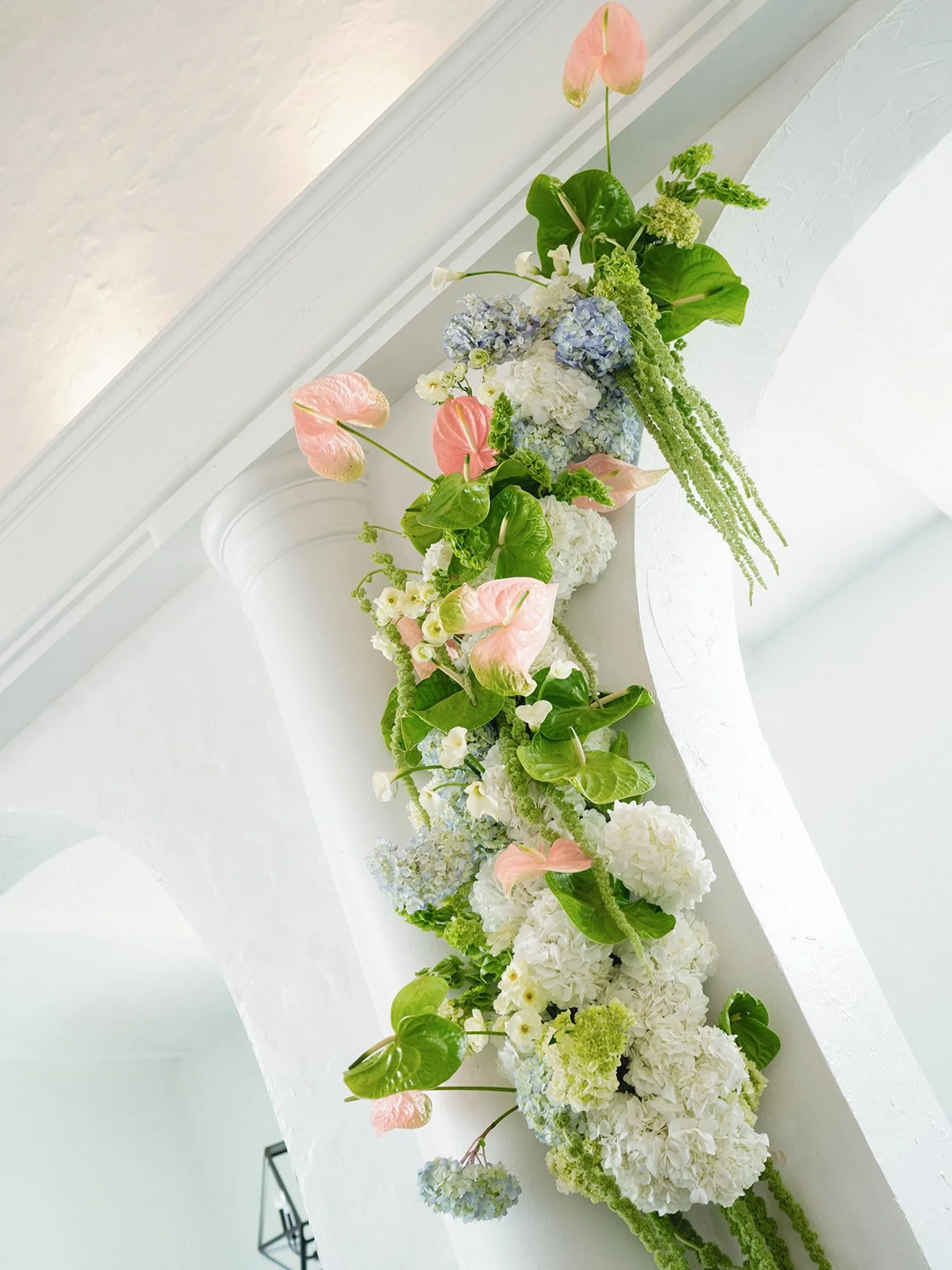 Sculptural modern spring wedding hanging floral installation anthurium amaranth midtown la villa spring flowers the cottage rose kansas city wedding florist crossroads ceremony decor