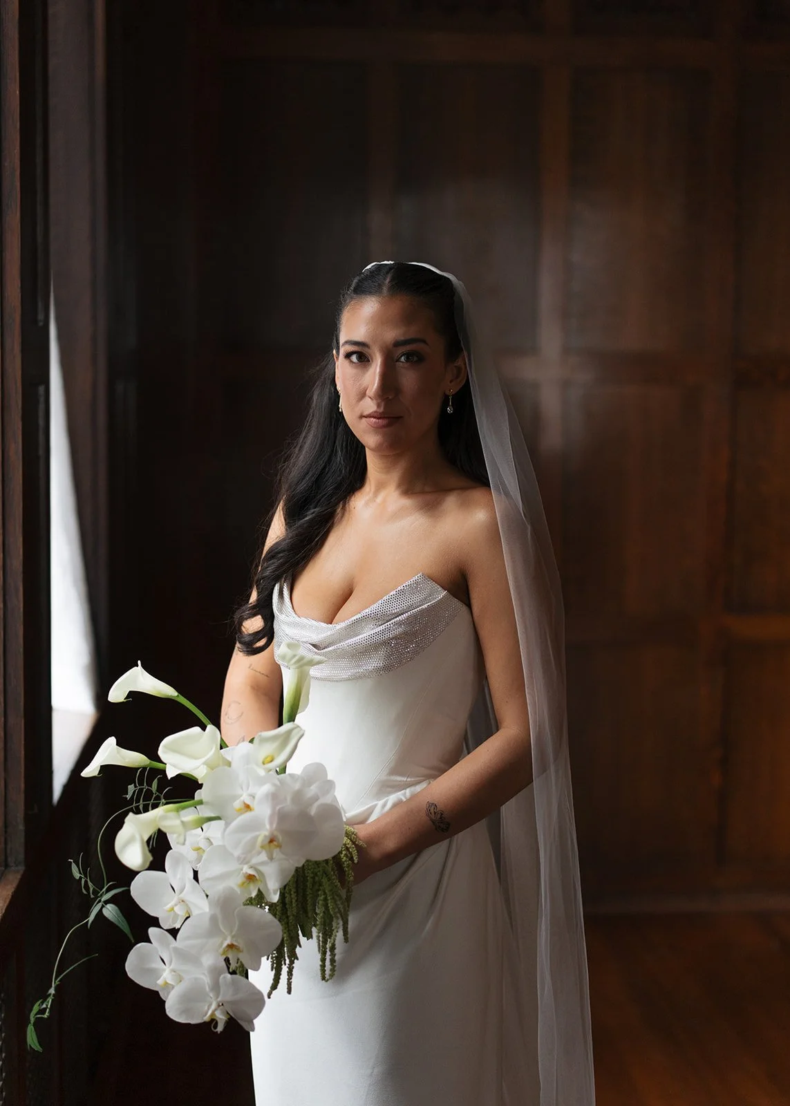 Modern chic november fall wedding downtown hotel kansas city orchids calla lilies amaranth anthurium bridal portrait chic bridal style the cottage rose kansas city wedding florist crossroads