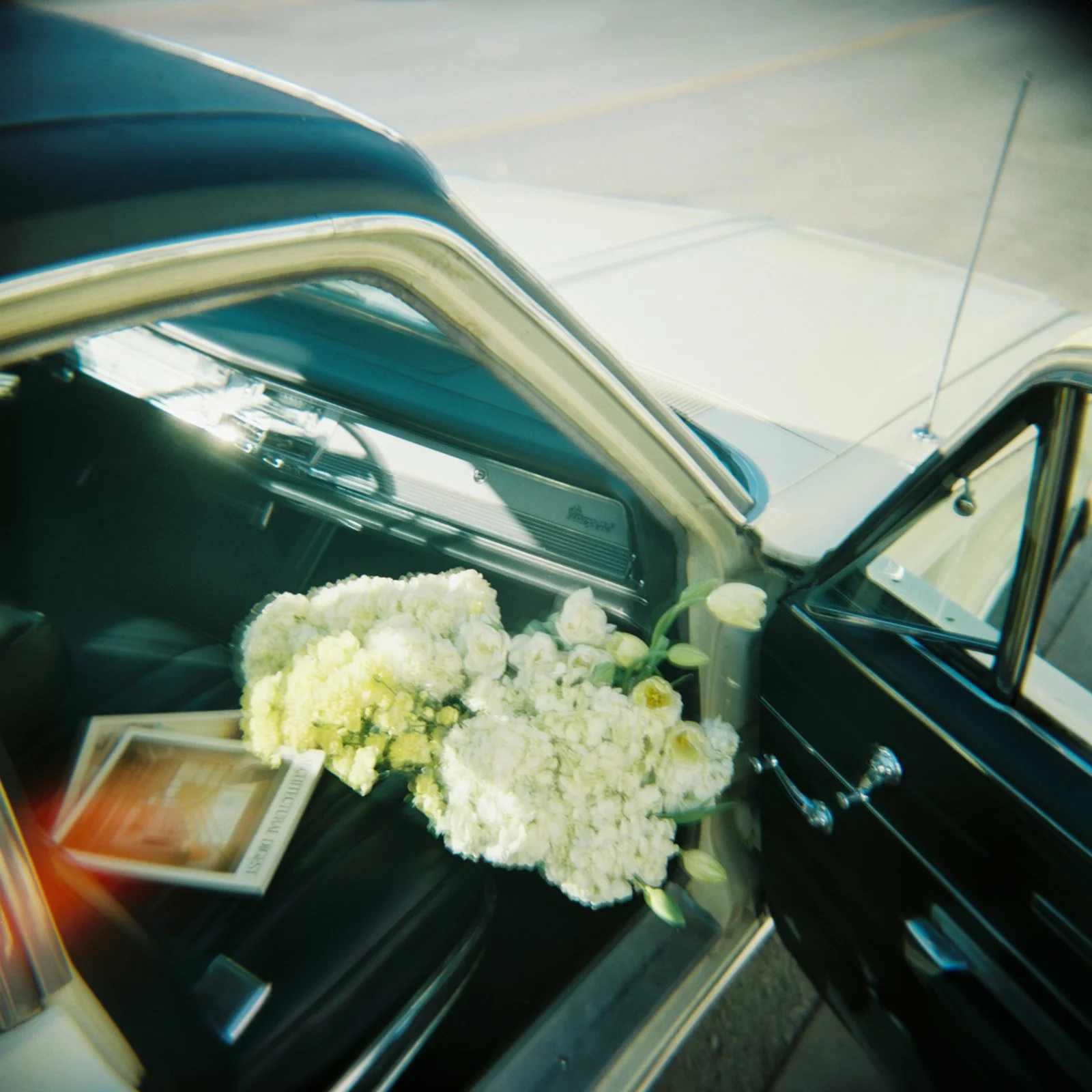 vintage car holding hydrangea the cottage rose kansas city wedding florist crossroads branding shoot interior designer