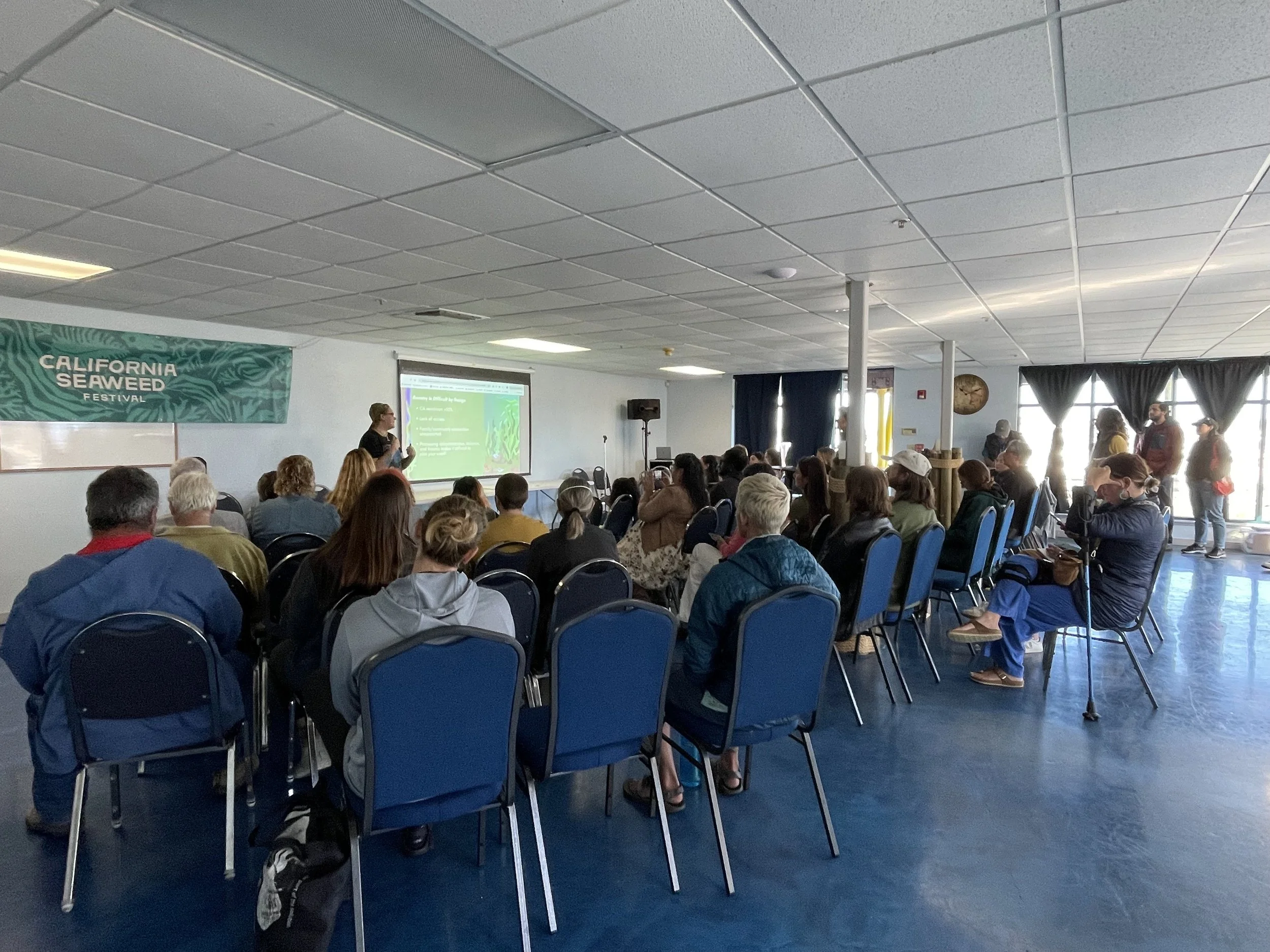 Audience attending a presentation at the California Seaweed Festival