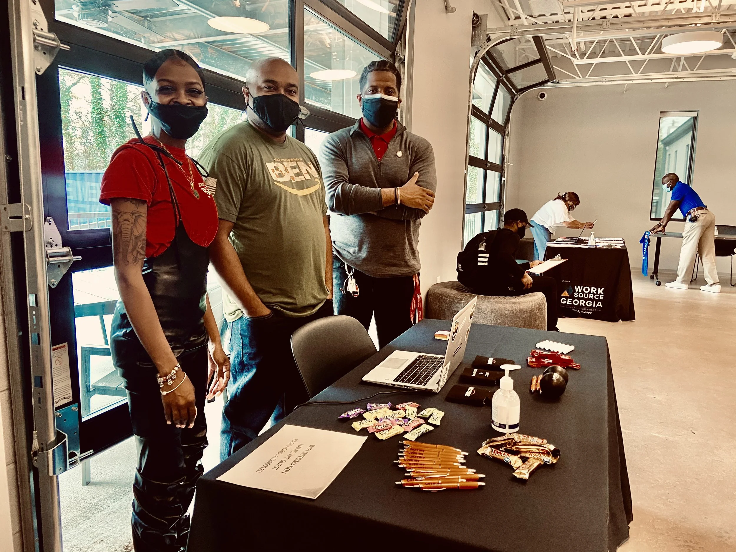 Two people in a job interview setting; one person is holding a document.