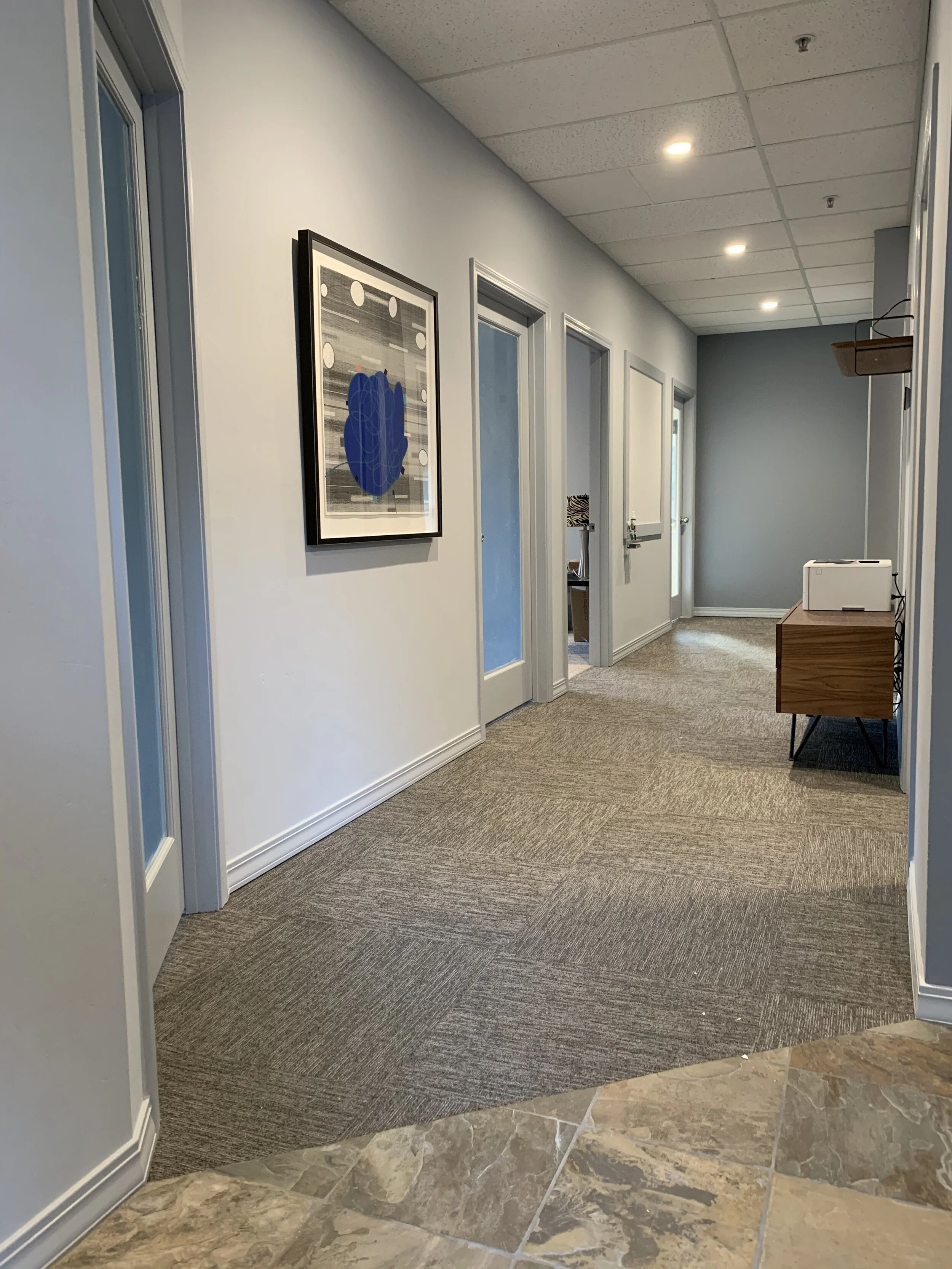 Each office has a private locked door, though most leave unlocked in our trusting environment. There are several whiteboards available in the common area hallway, and in the open conference room.