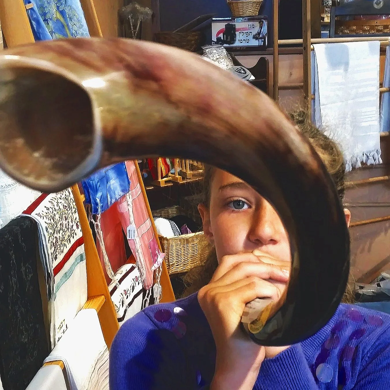 Girl blowing the Shofar for Rosh Hashanah