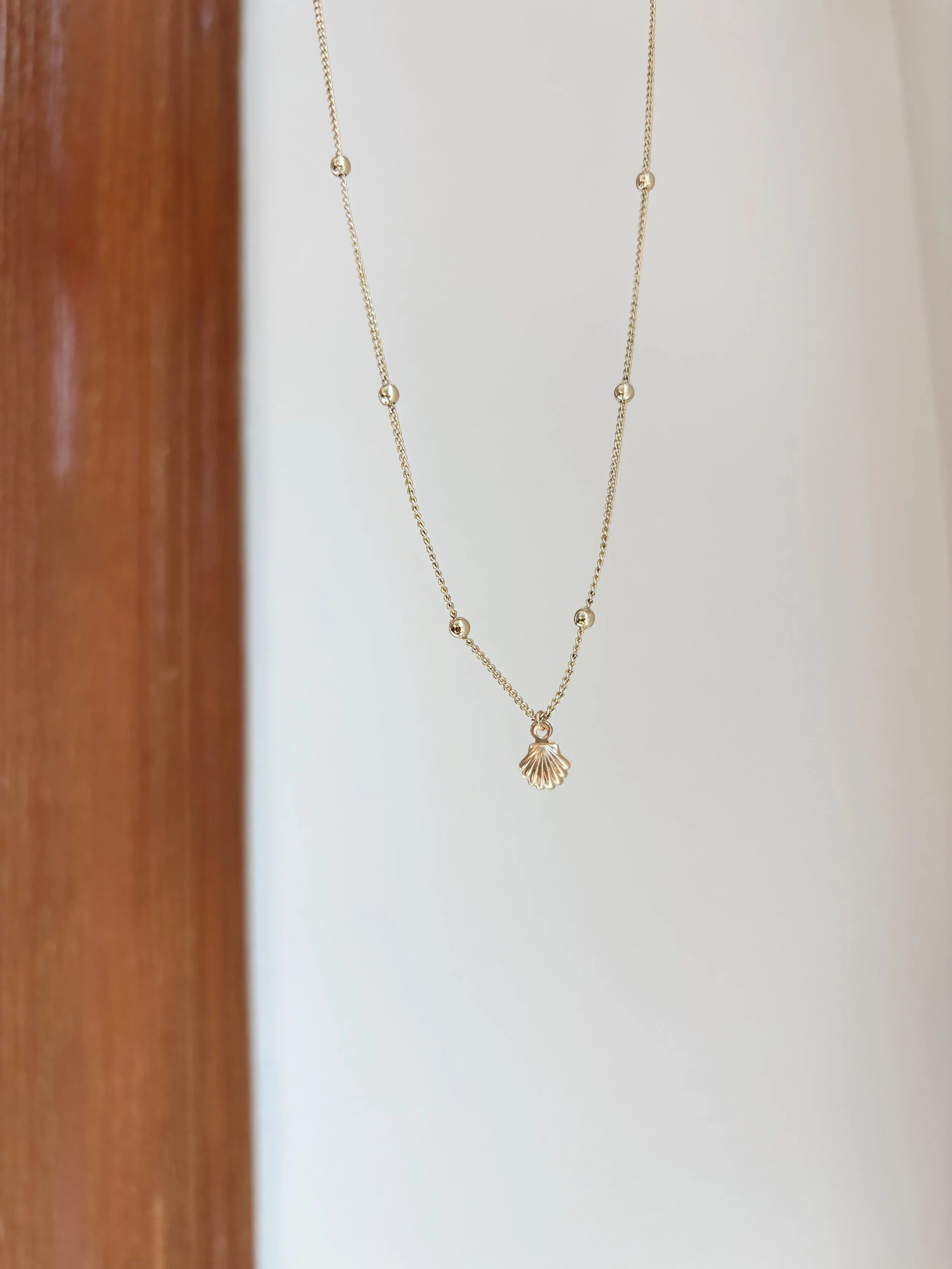 The Reef Necklace on the Dainty Gold-Filled Ball Chain