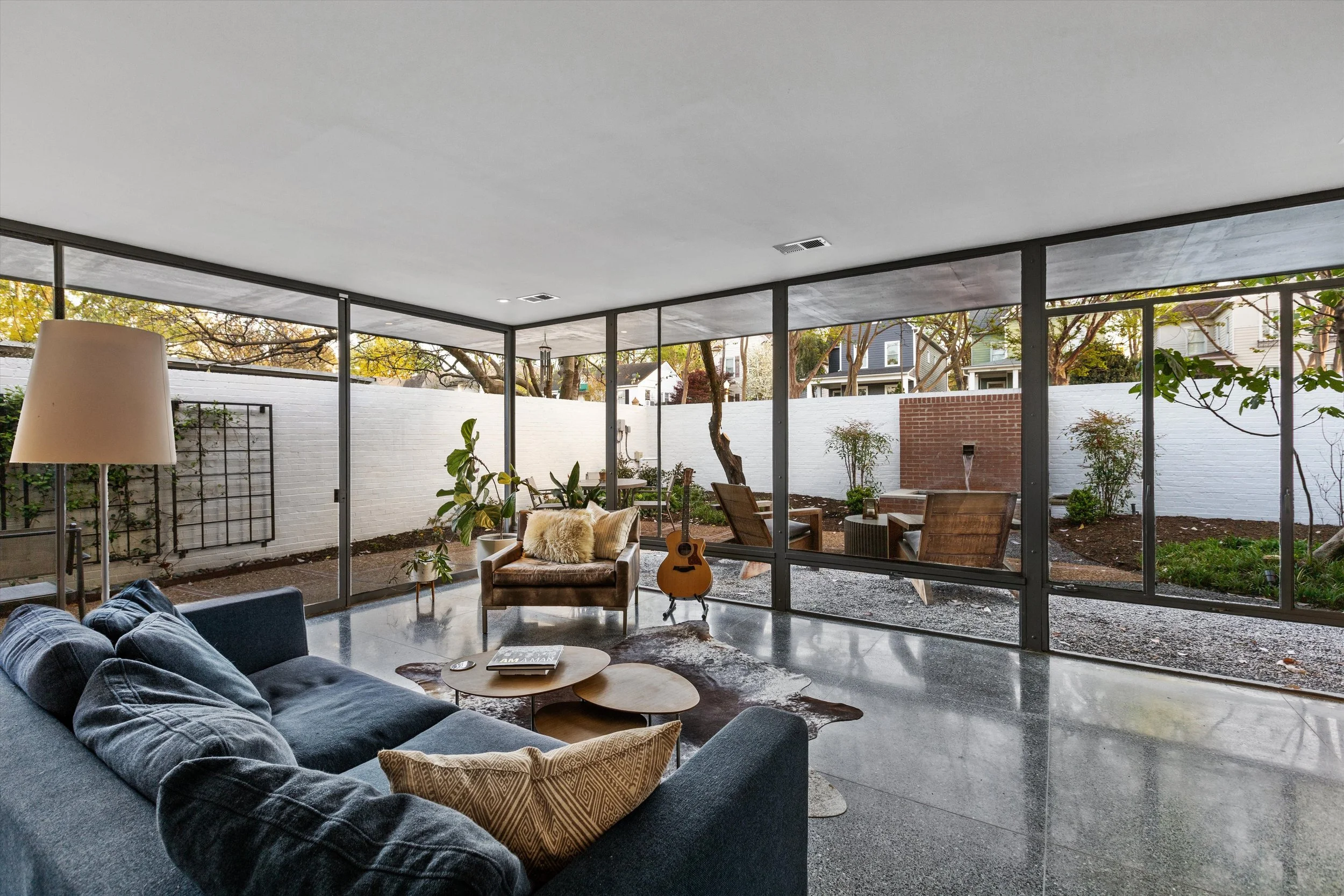 Den opens to patio and garden