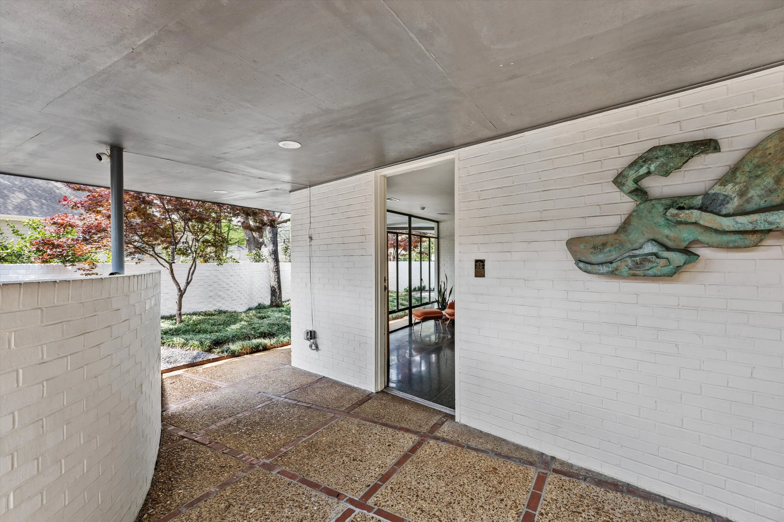 Covered patio with Ted Rust sculpture