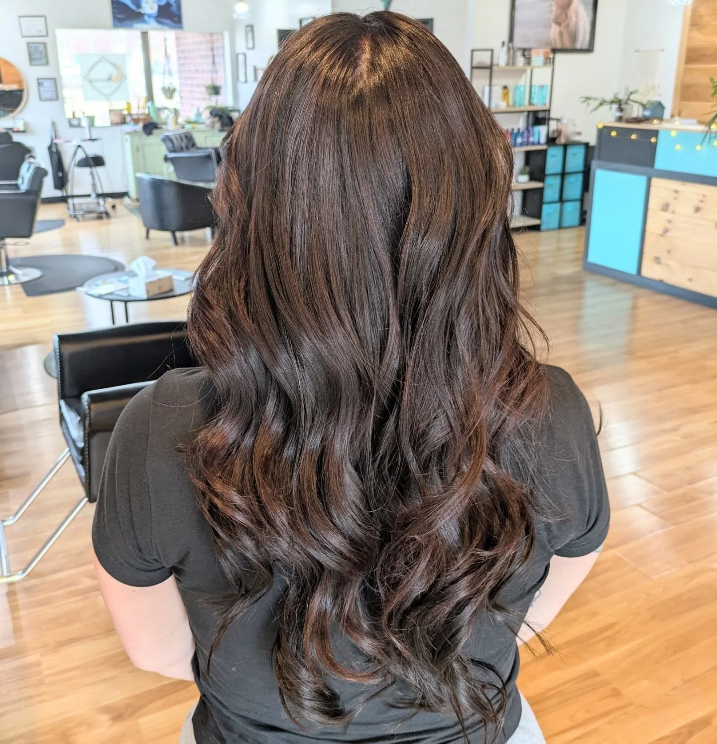 Dark Chocolate Lava 
Slowly taking this beauty from black to brown. 
First two photos are today's results from a gentle color remover and baby lights followed by a root and glaze. Giving her the volume she loves with some fusion extensions. 
Third ph