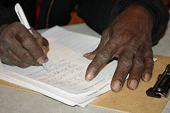 black-man-signing-papers.jpg