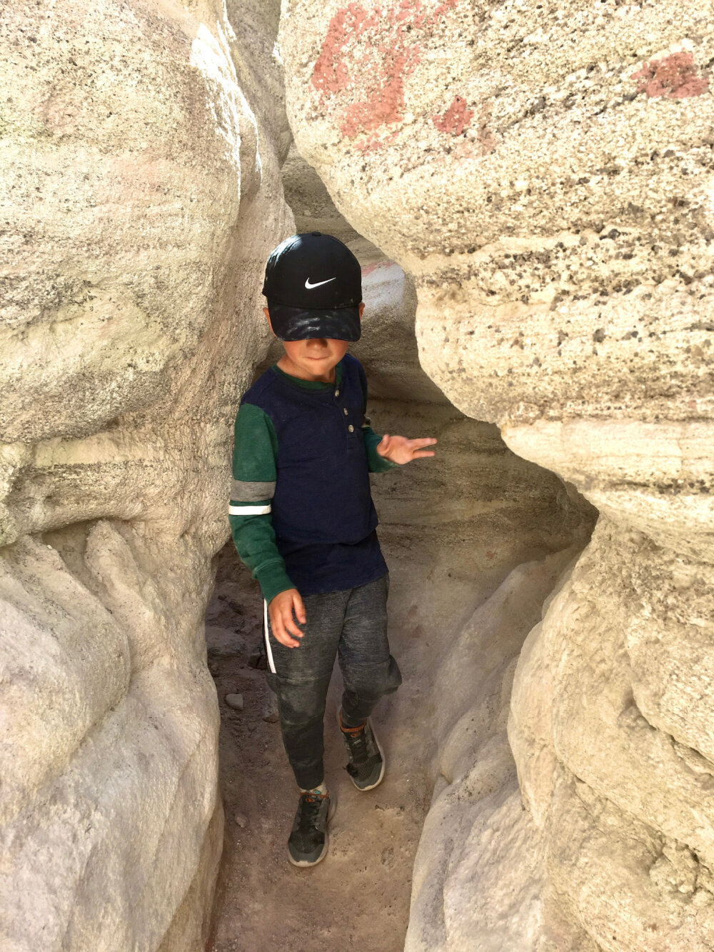 Young hiker exploring painted mines