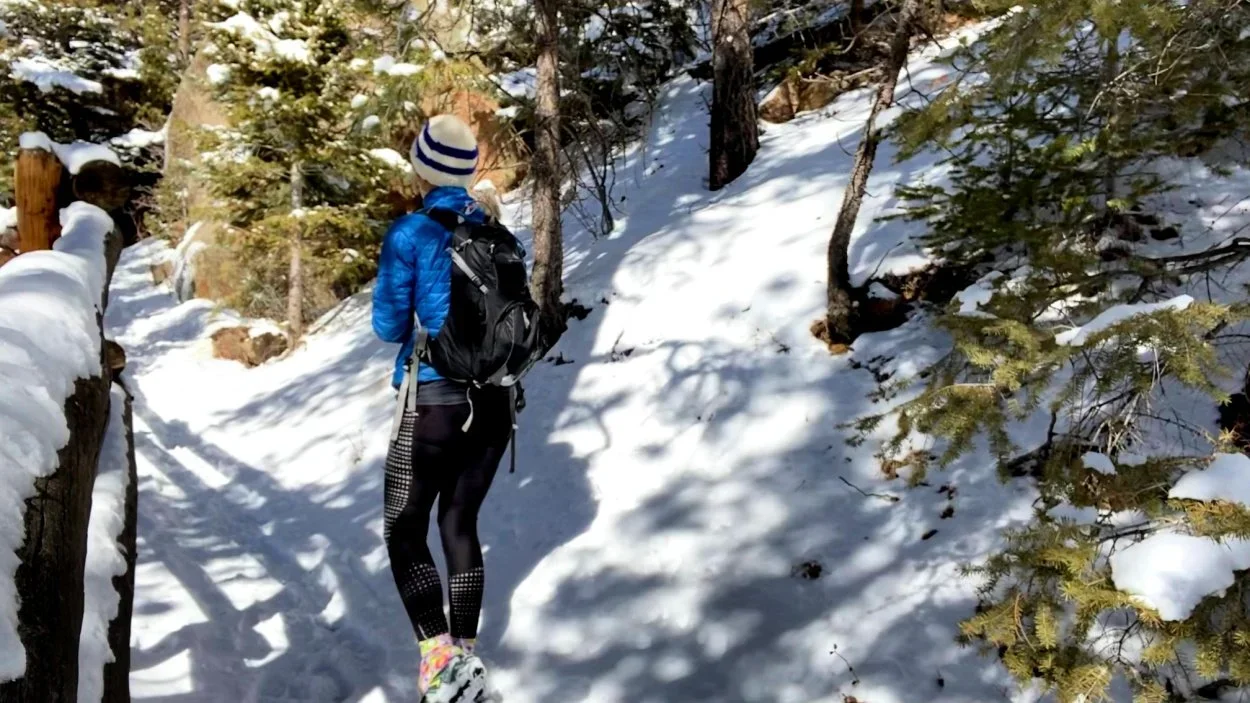 woman hiking down barr trail