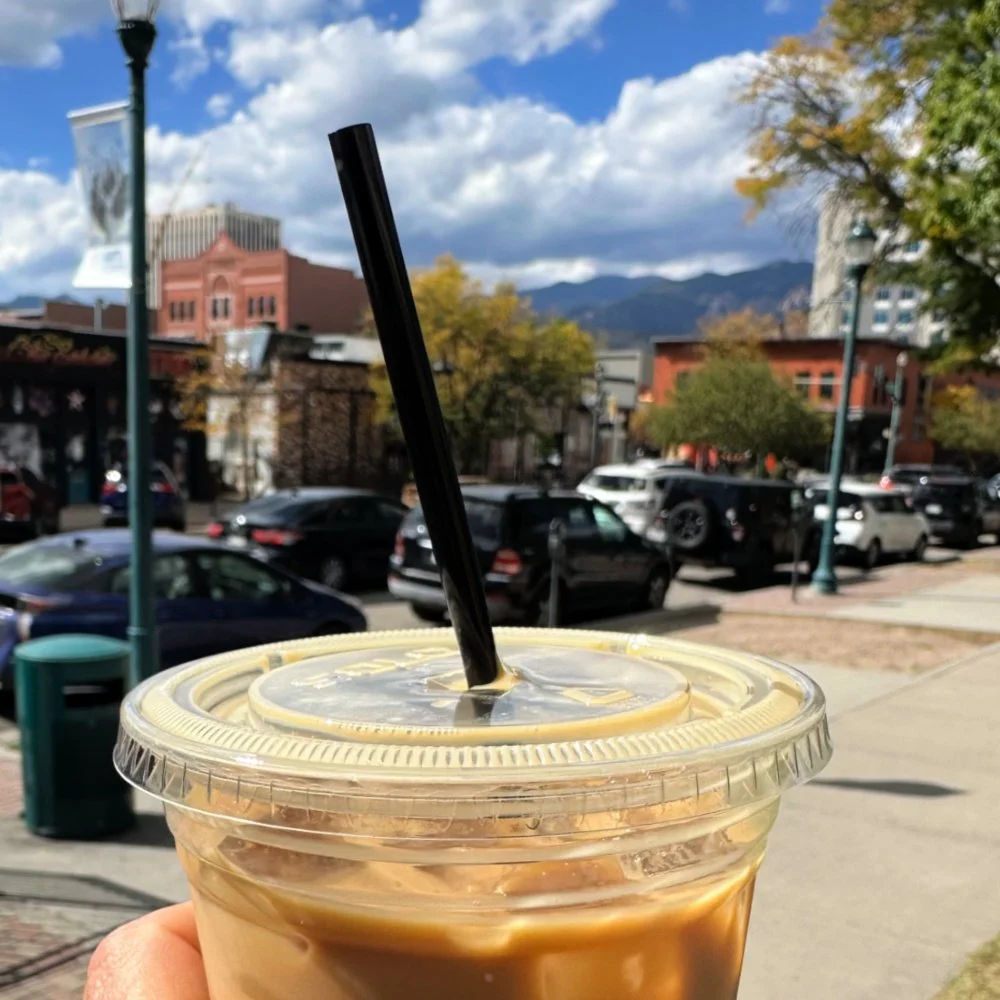 coffee cup with pikes peak mountains in background