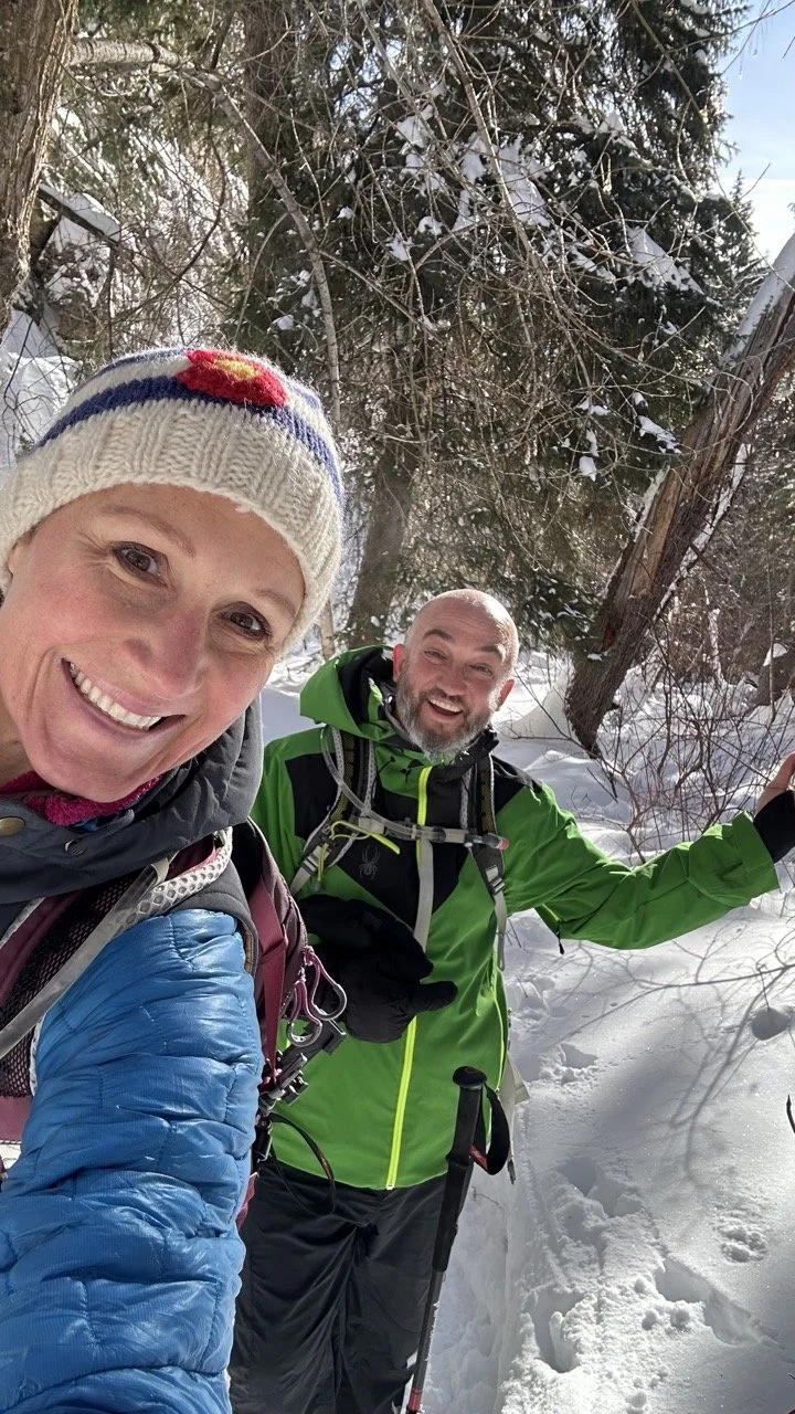 man and woman hiking mt esther in winter