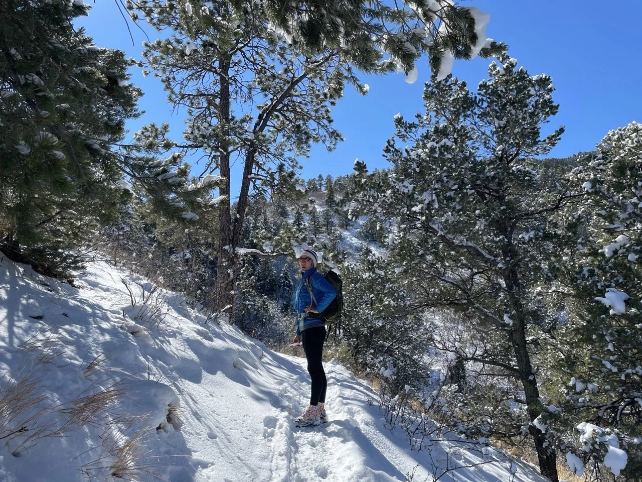 woman hiking in colorado springs in winter