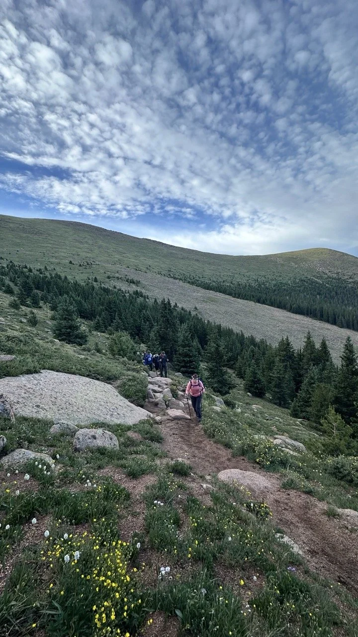 hikers going up pikes peak on crags trail