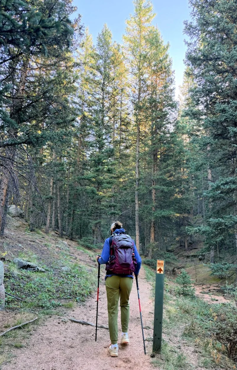 woman hiking with msr trekking poles