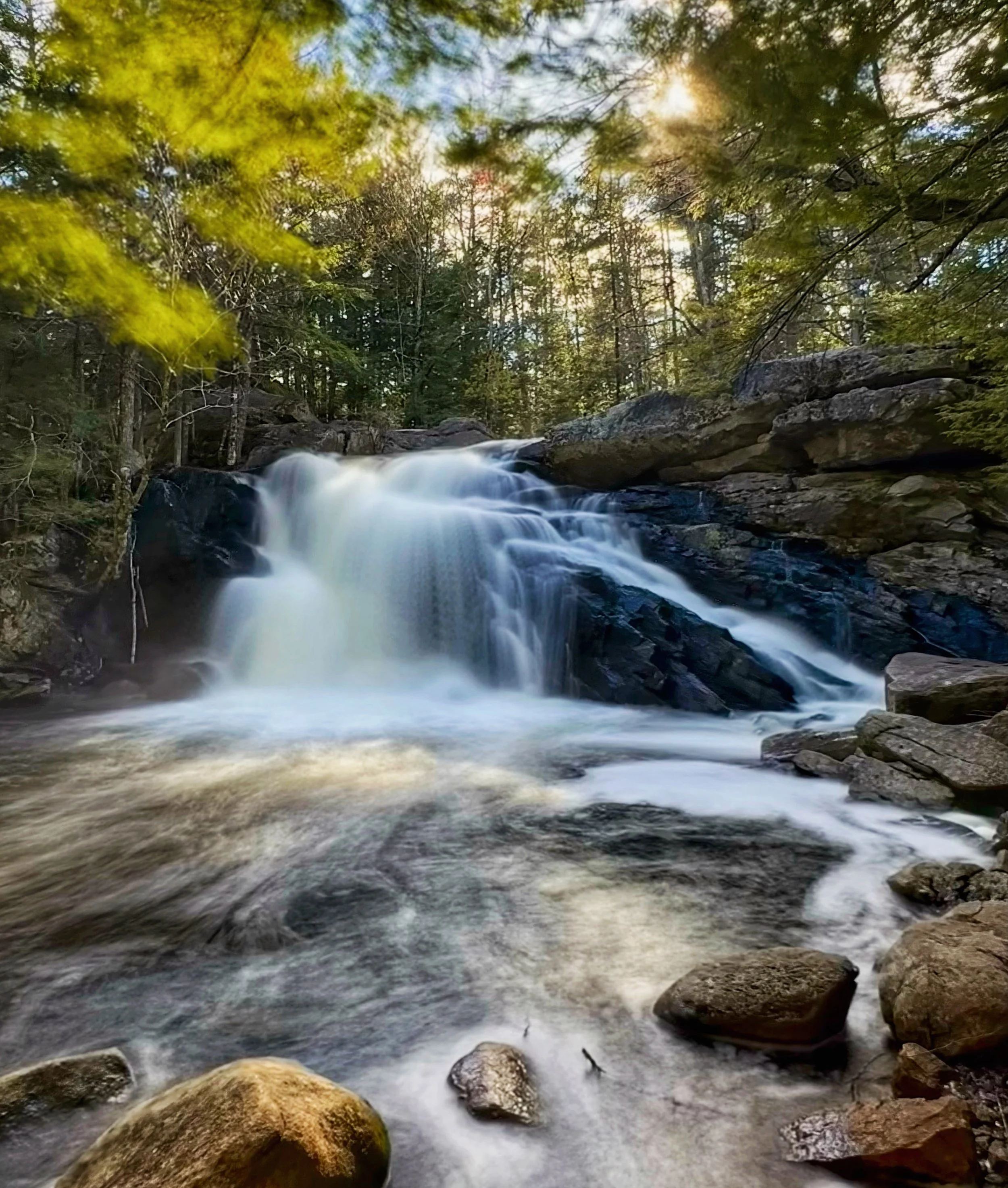 Lower Purgatory Falls rushing down over boulders in Lyndeborough, New Hampshire