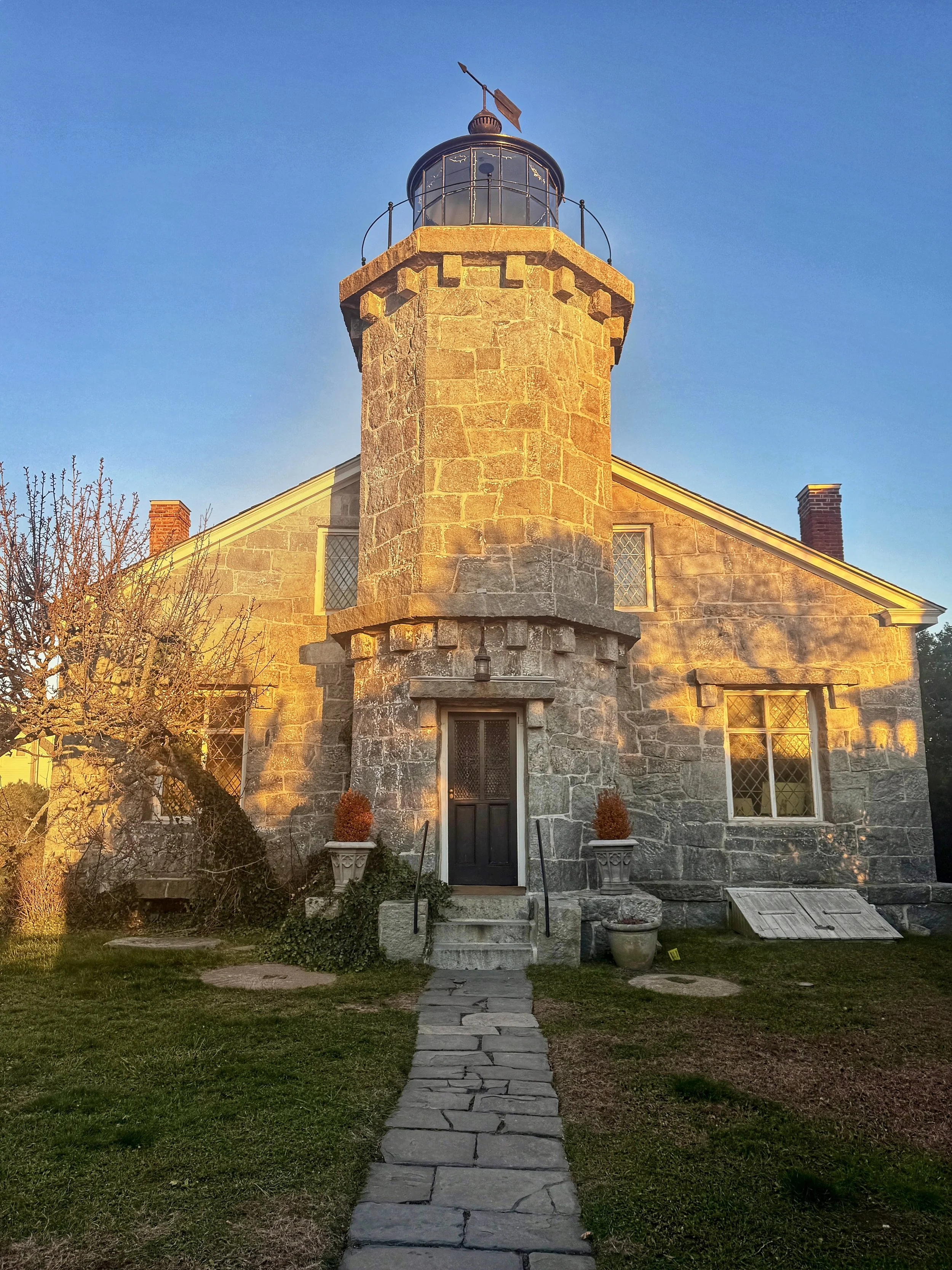 Evening golden hour light on Stonington Harbor Light in Stonington, Connecticut