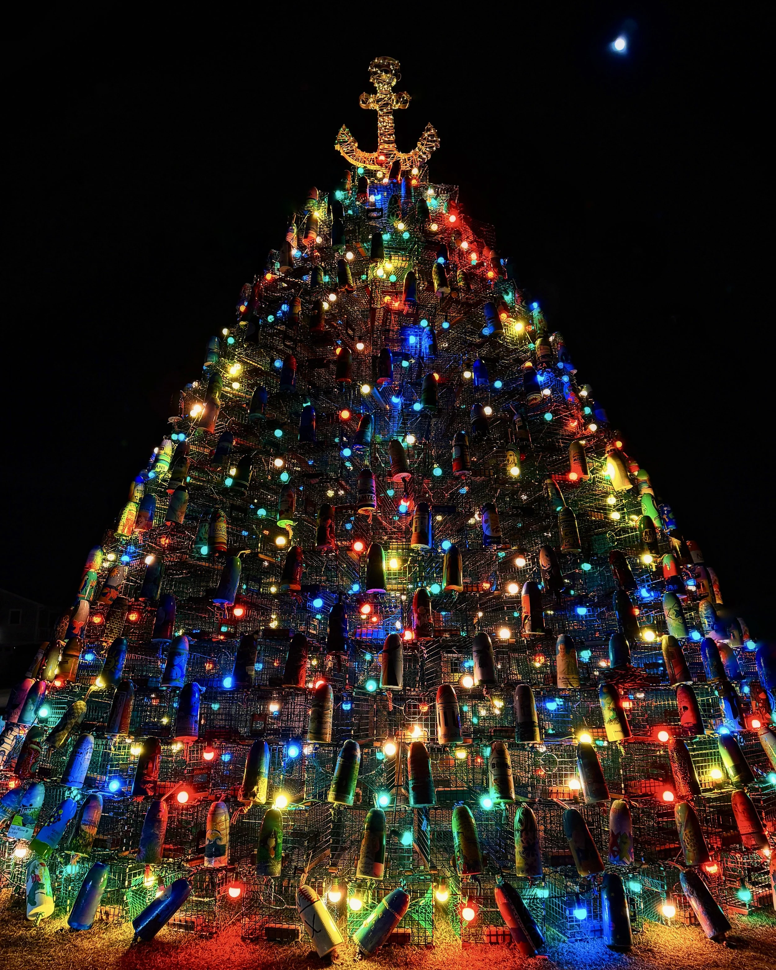 Stonington Connecticut's Lobster Trap Christmas Tree lit up at night