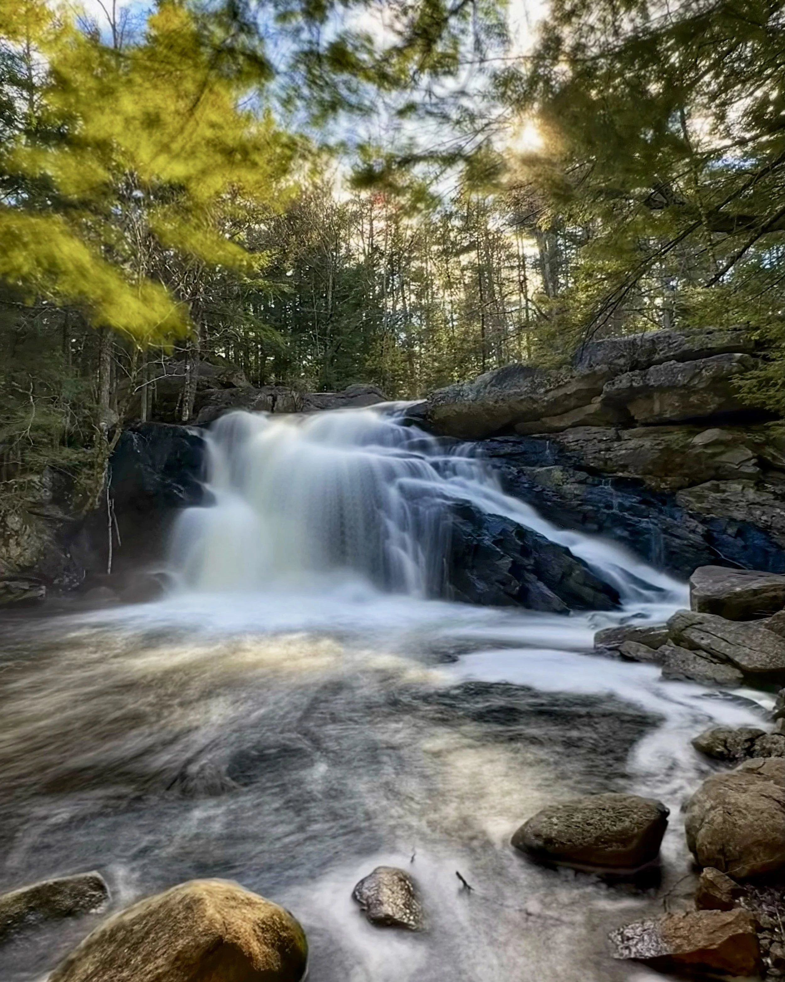 Lower Purgatory Falls plunging down over boulders in Lyndeborough, New Hampshire