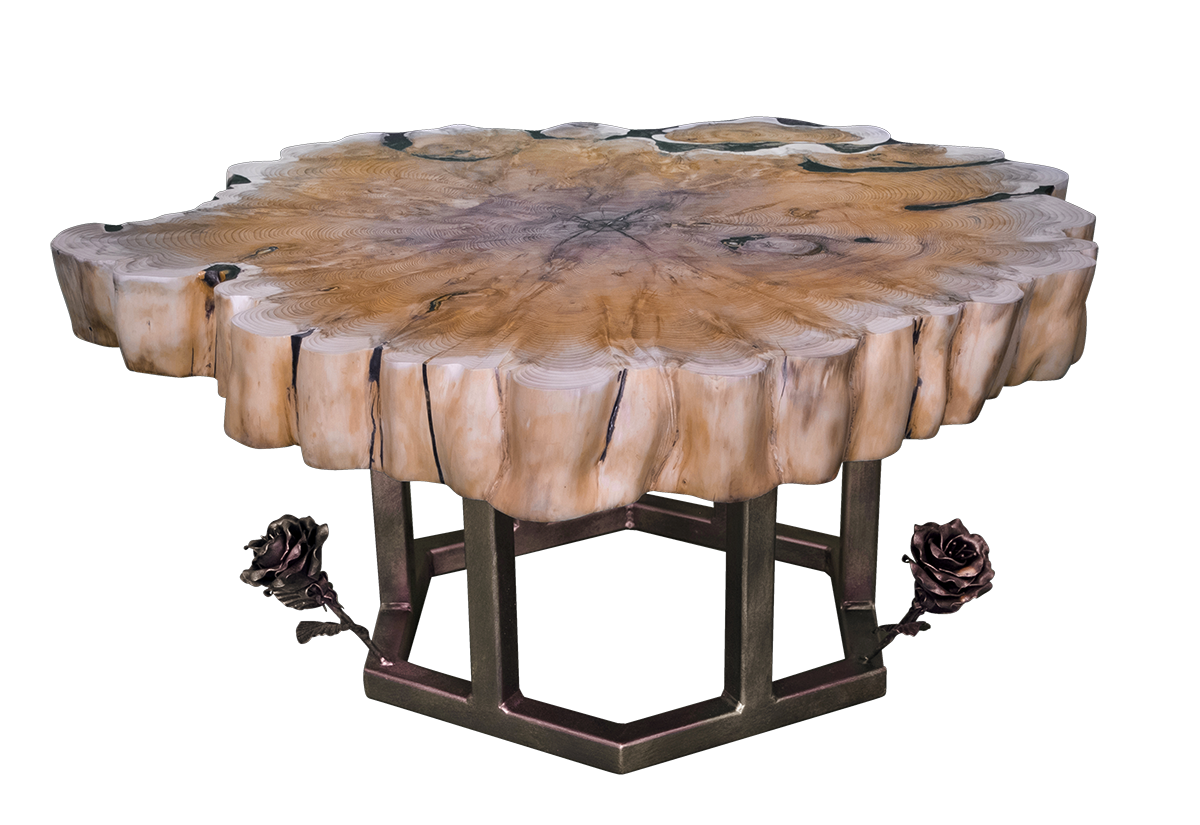 From the front, the Yew Slap Coffee Table shows its unique form — the organic curves of the crosscut yew slab resting lightly above the geometric metal base.