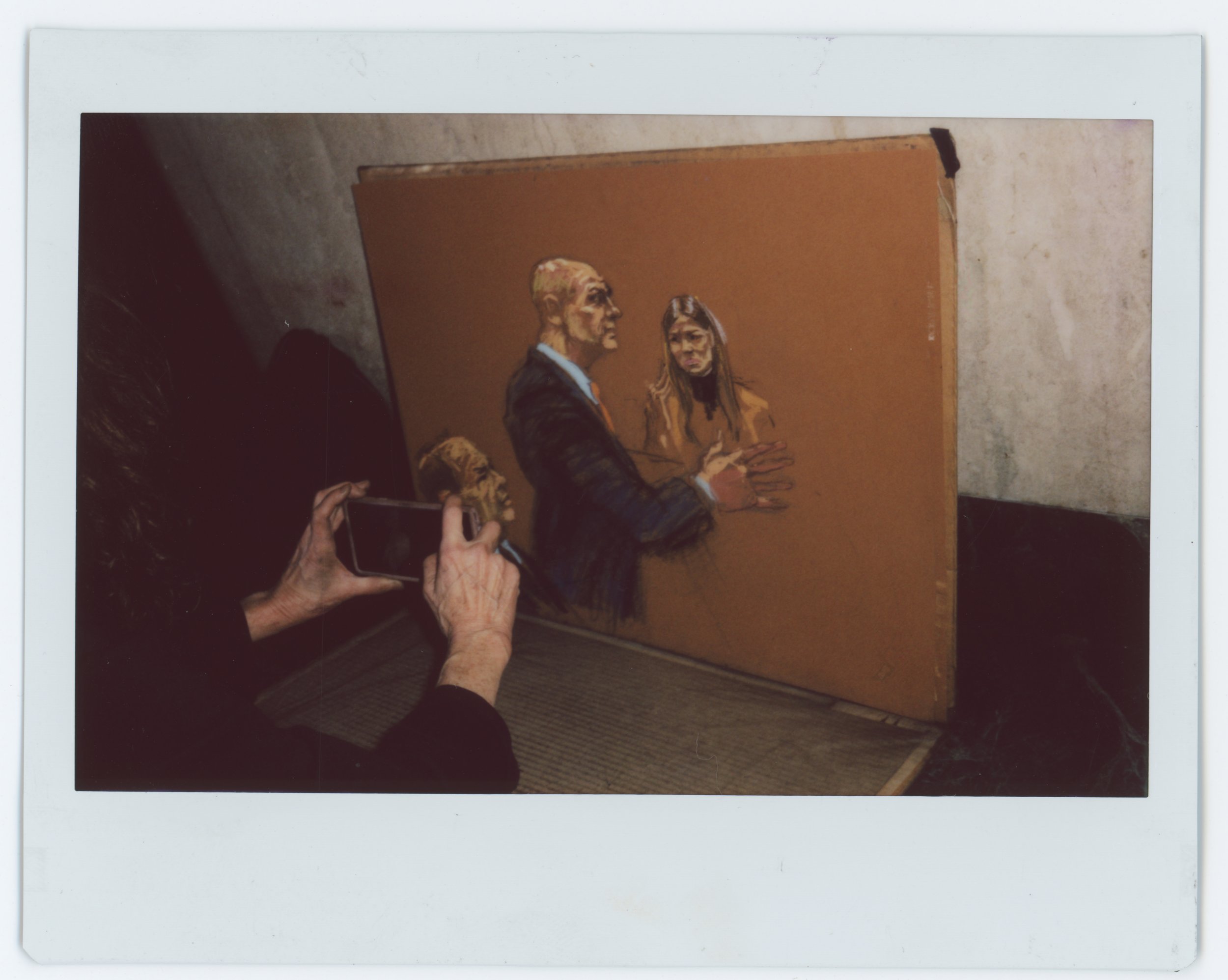 This is Jane Rosenberg taking a picture of her sketch of Harvey, Aidala, and a witness whose name I'd have to look up. There's a picture of Jane in the Maxwell project.