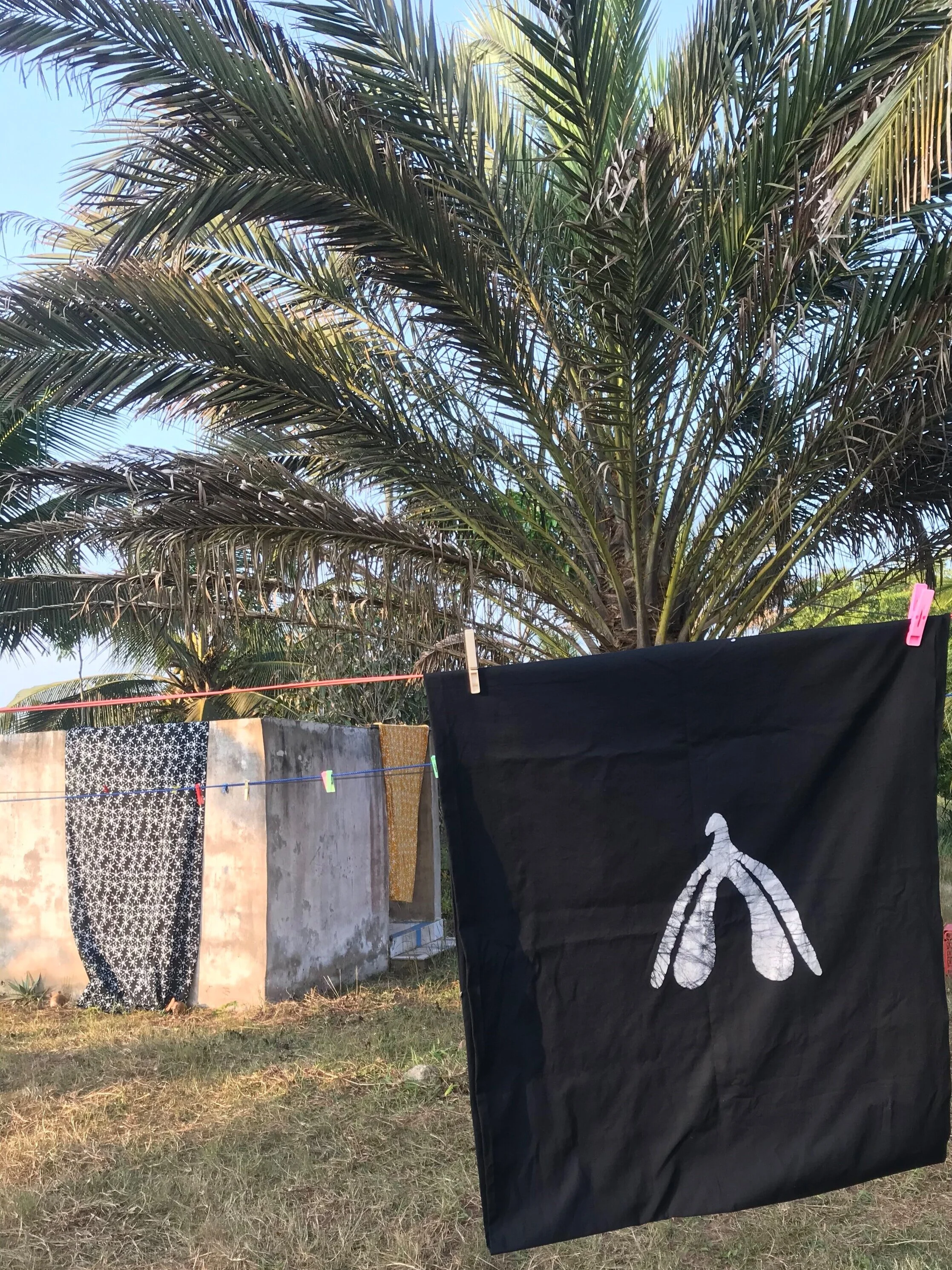 the first sample of the clitfabric. drying in the sun after it’s first washing. breeze breezing of the ocean, of the vibes at @sunflowerbeachresortghana