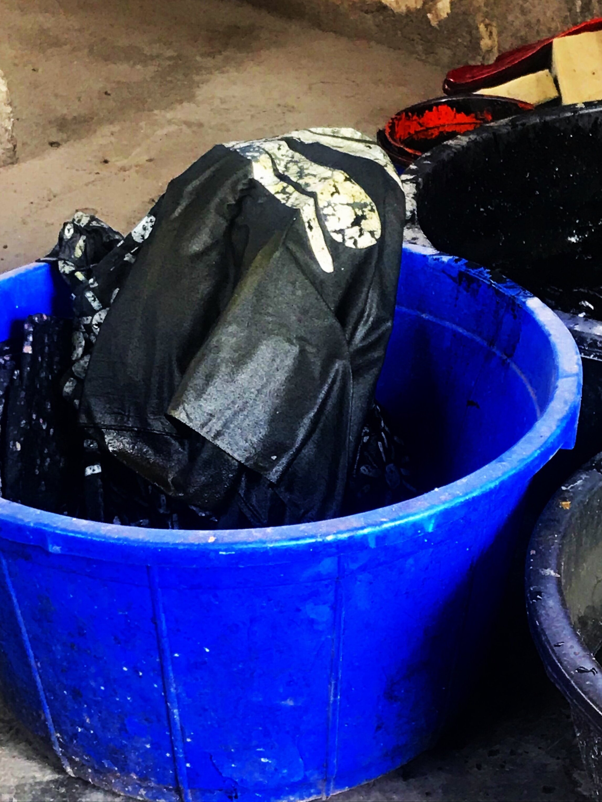 the clit fabric. dried wax on originally white fabric. the cotton fabric soaked in black dyed water. the CLIT is a FACT. she is a fact. she exist’s. black on white. white on black. a fact.