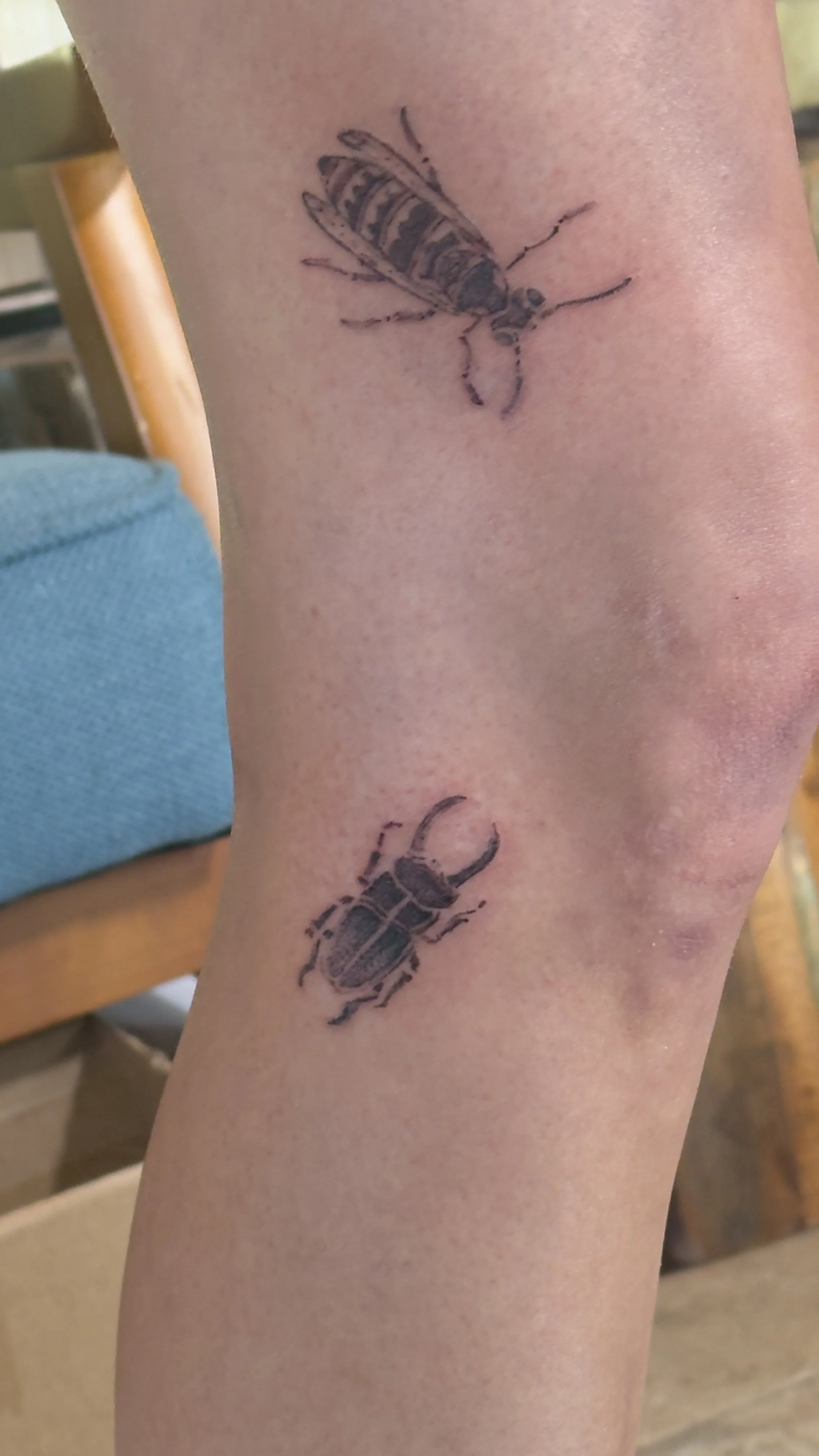 Insect tattoos on a leg